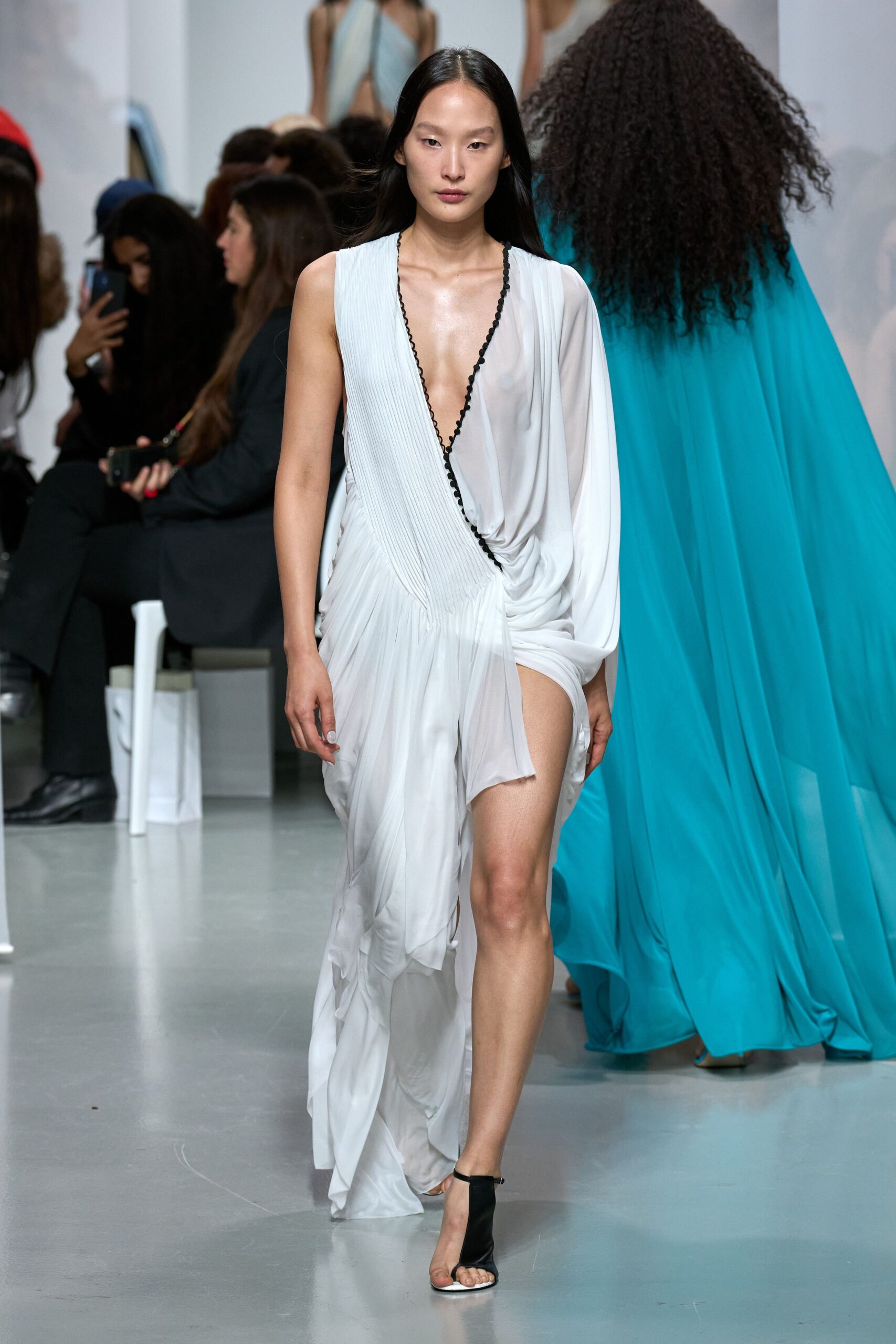 white silk sleeveless v-neck fitted pleated flowing gown