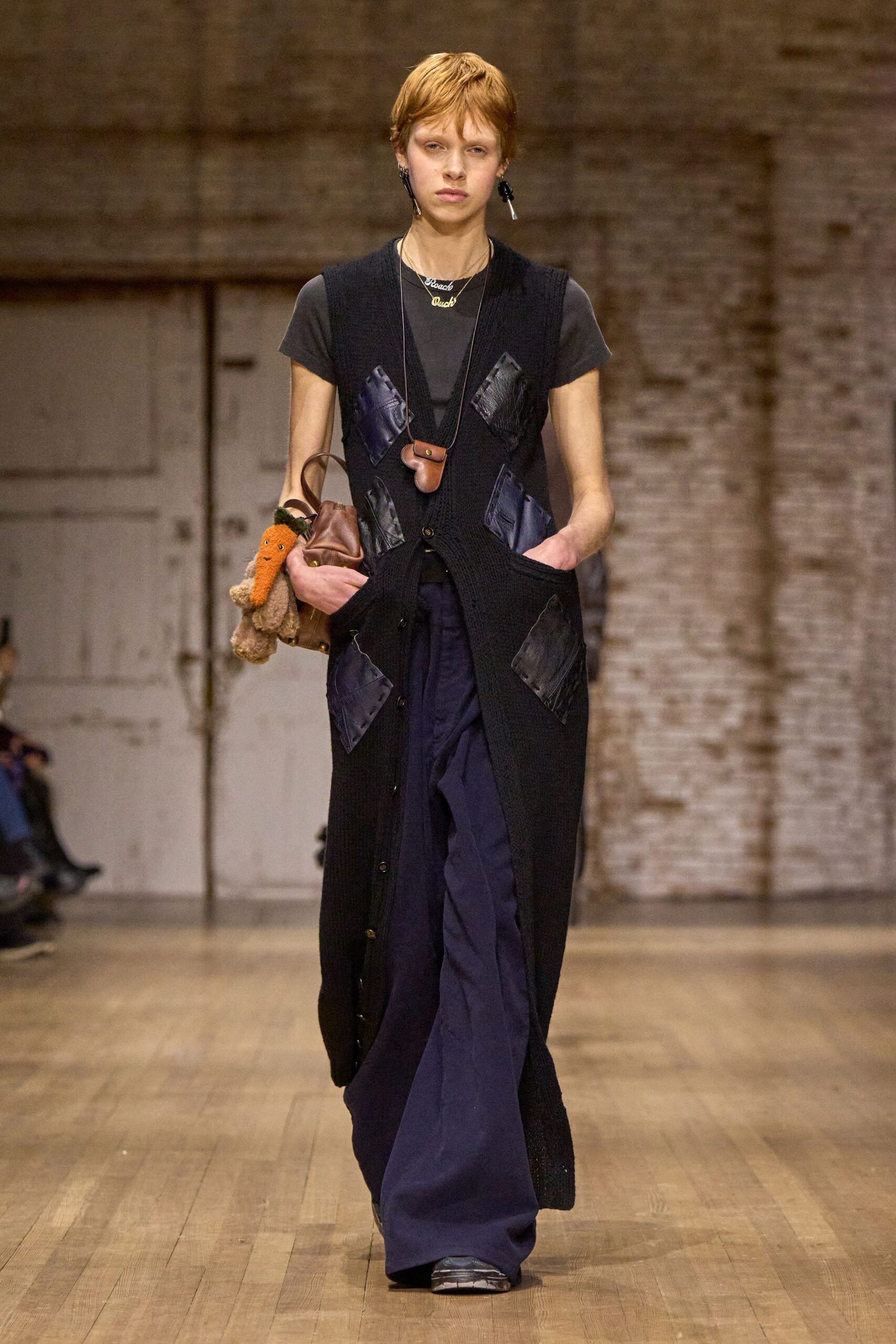 black vest with t-shirt and pants
