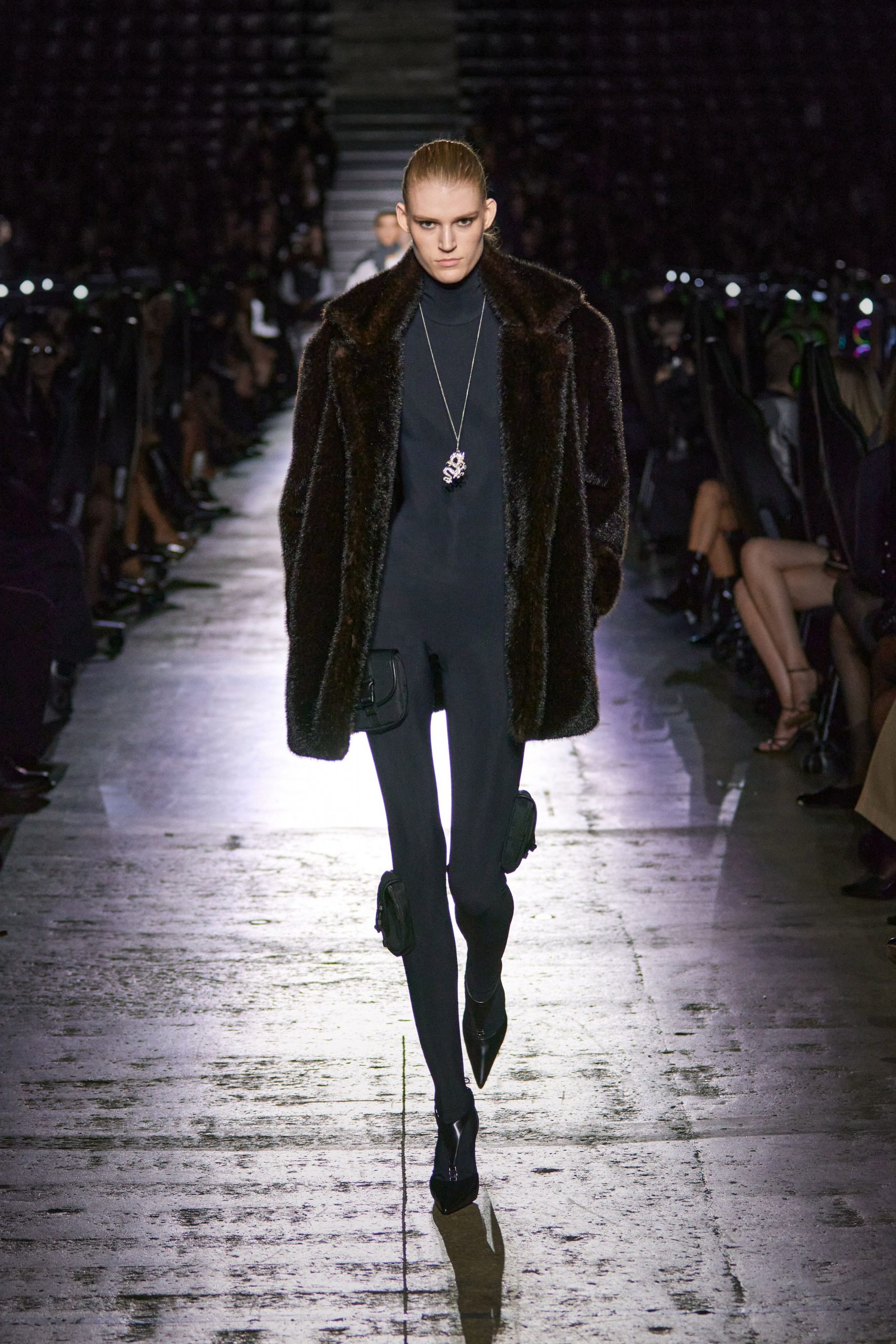 brown faux-fur coat black jumpsuit heels