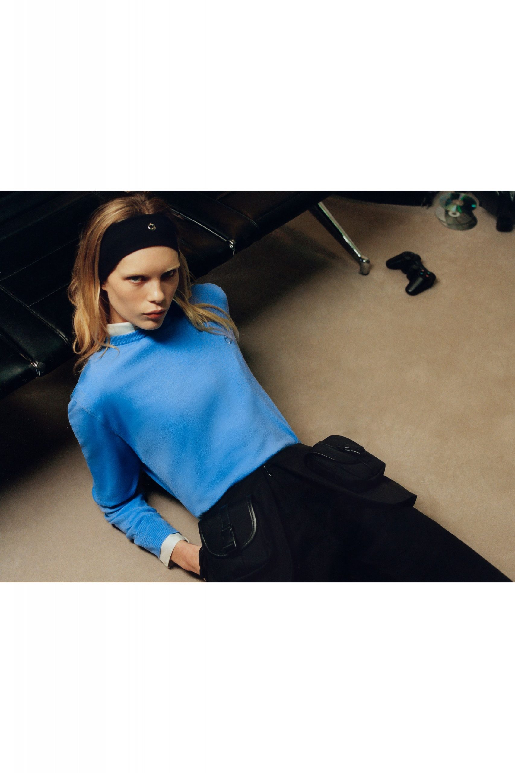 blue fitted top with black pants