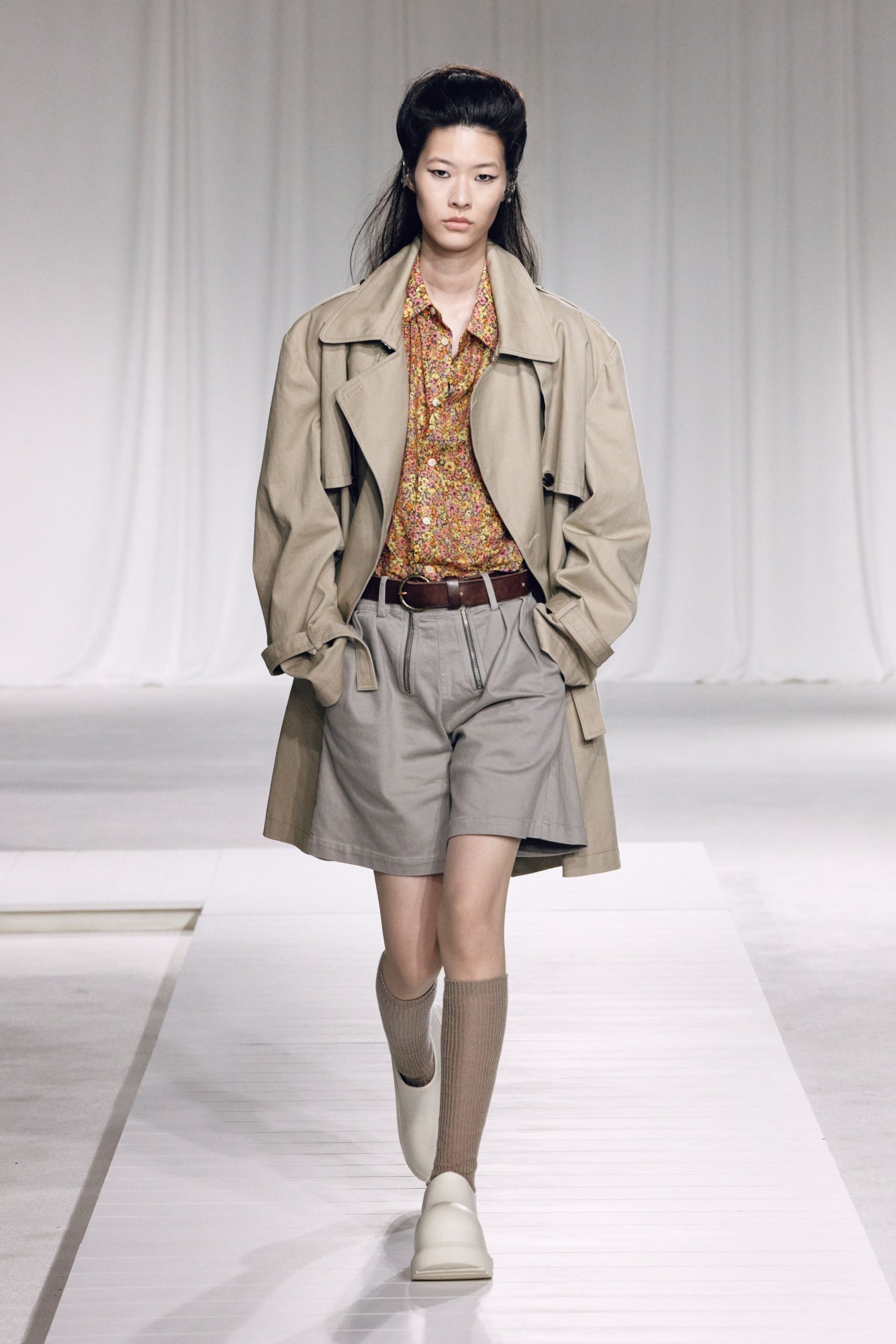 beige coat with floral shirt