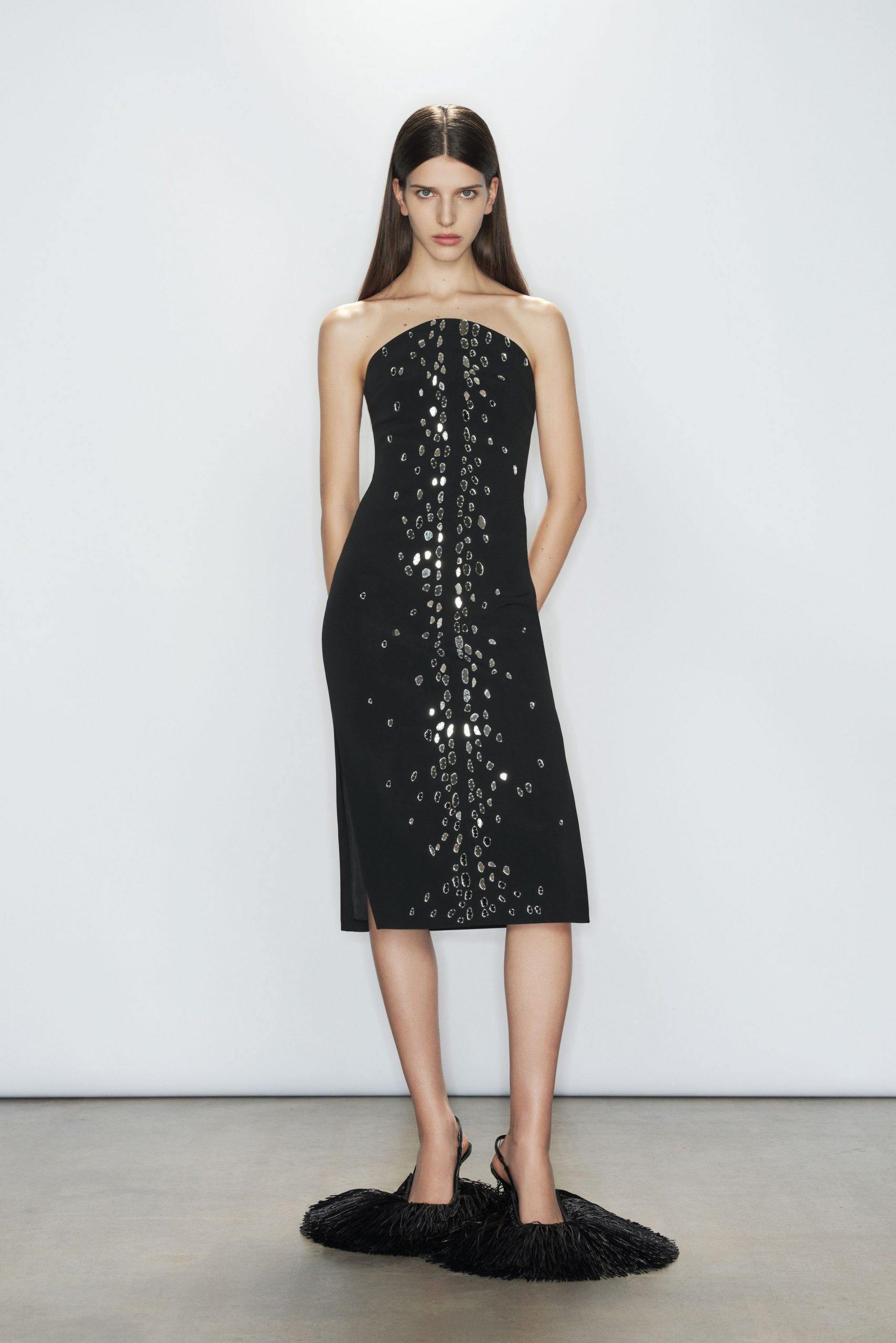 black strapless midi dress with fringed shoes