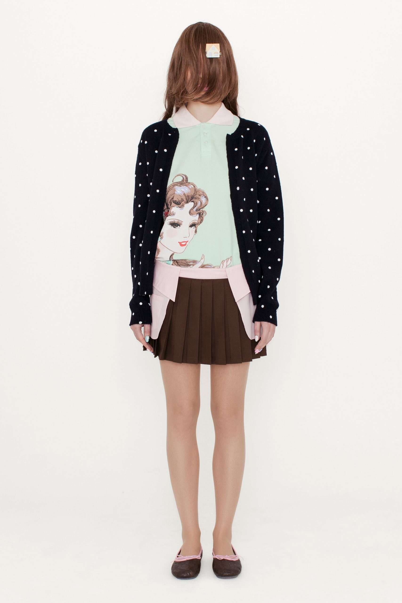 navy polka-dot cardigan with pleated skirt