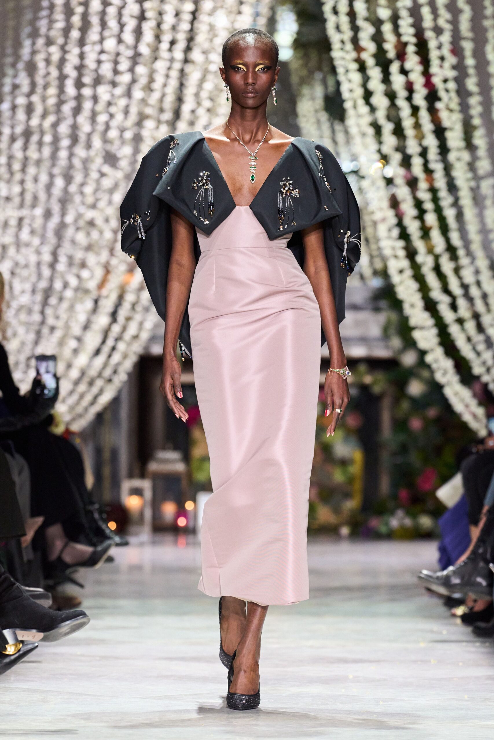 pink silk fitted dress with black cape