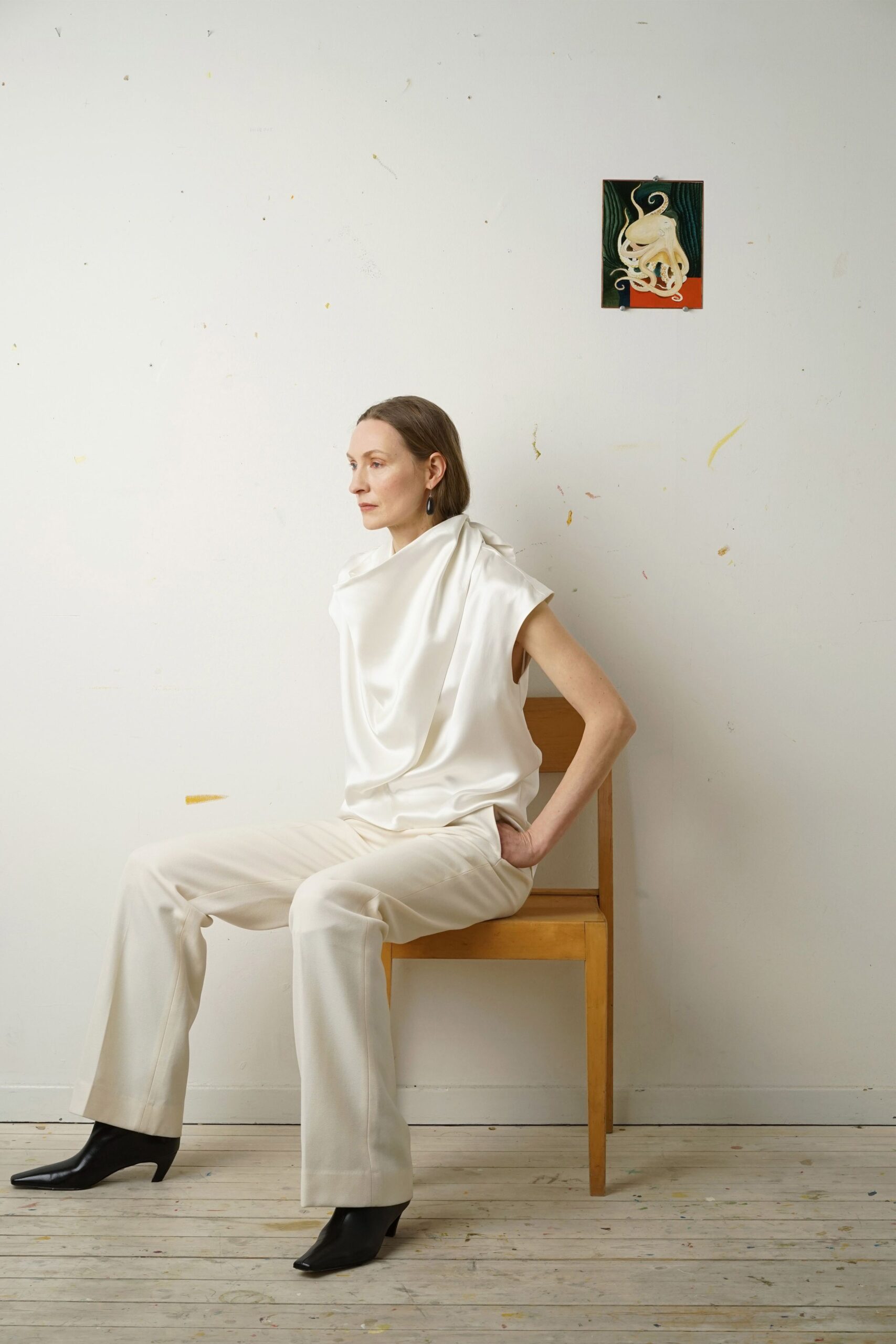 white silk relaxed top with beige pants