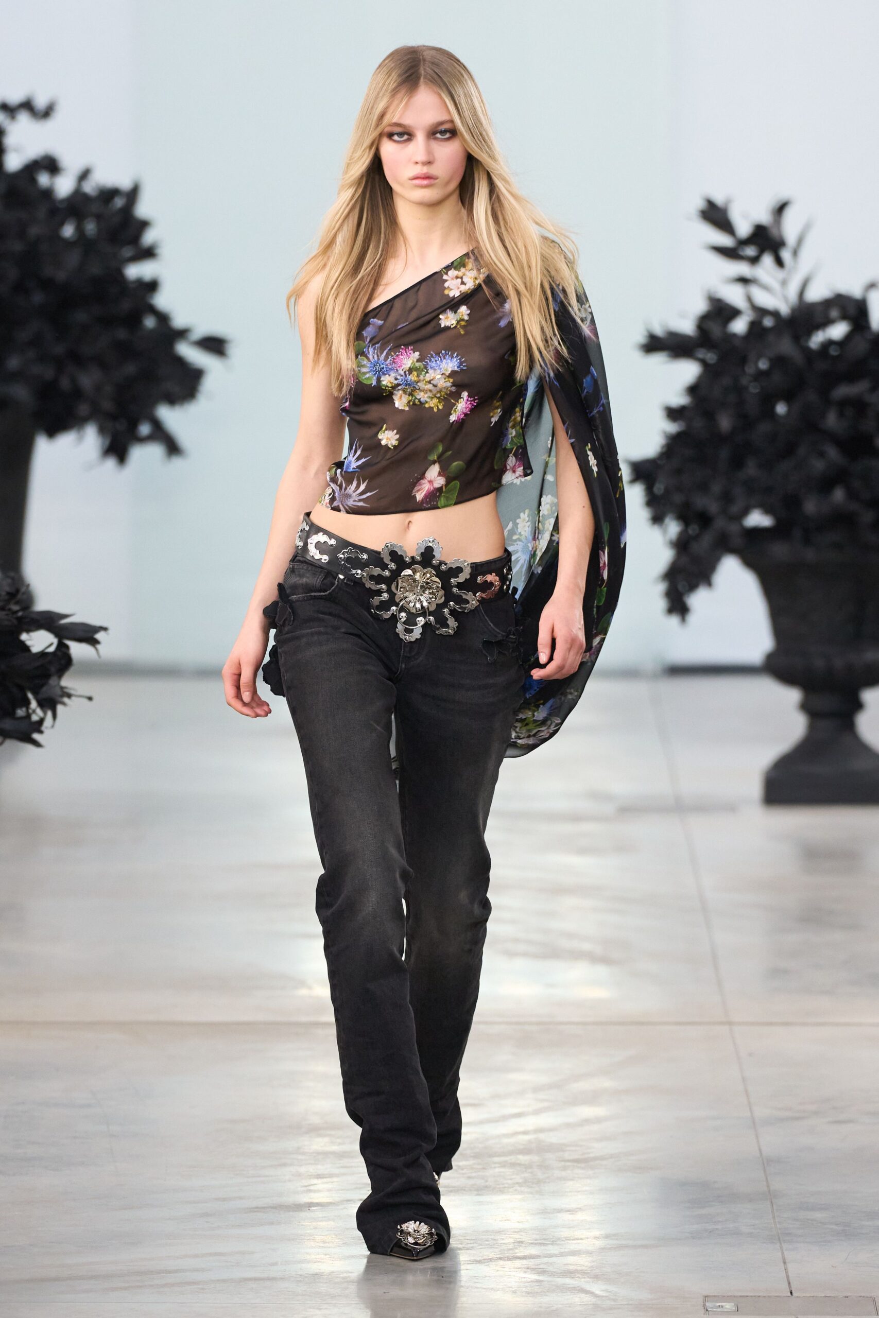 black floral asymmetric top with jeans