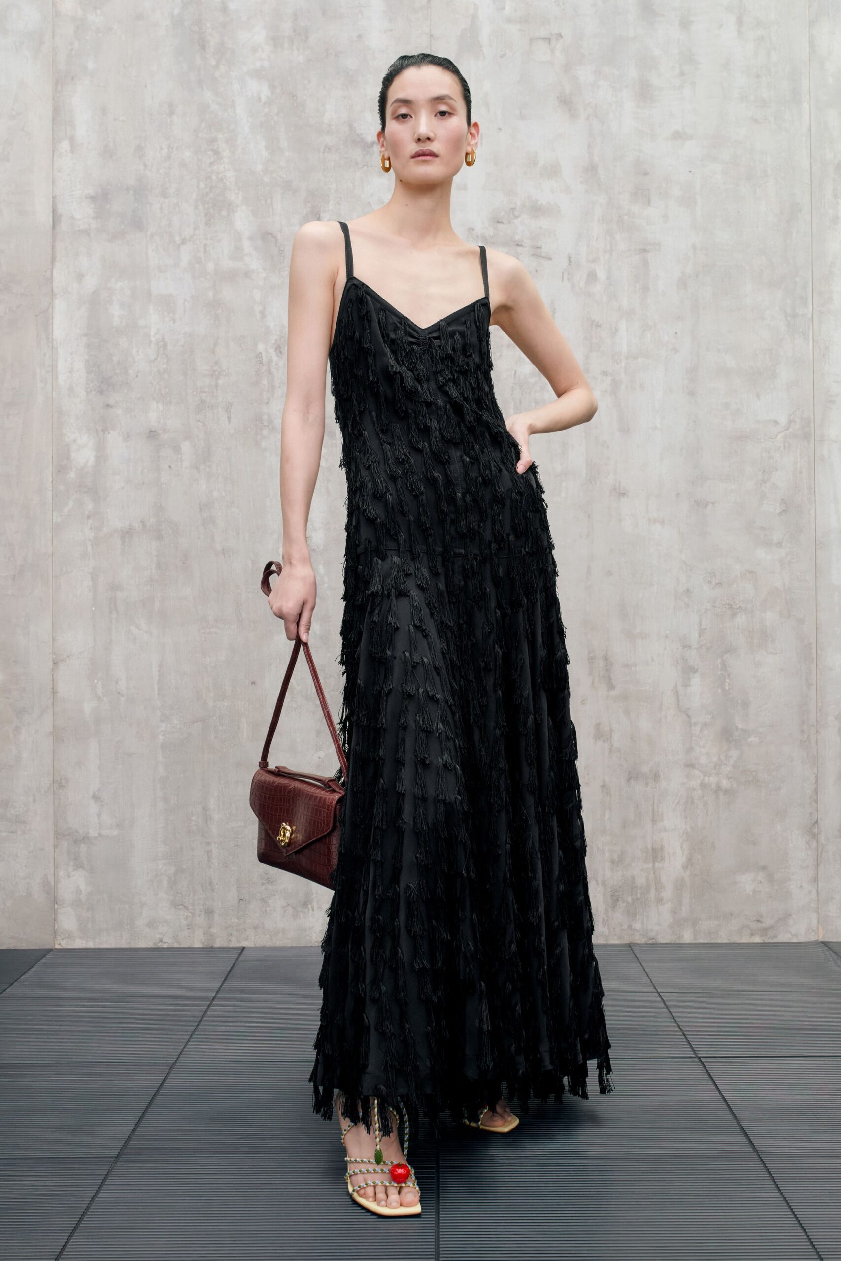 black ruffled maxi gown with heels