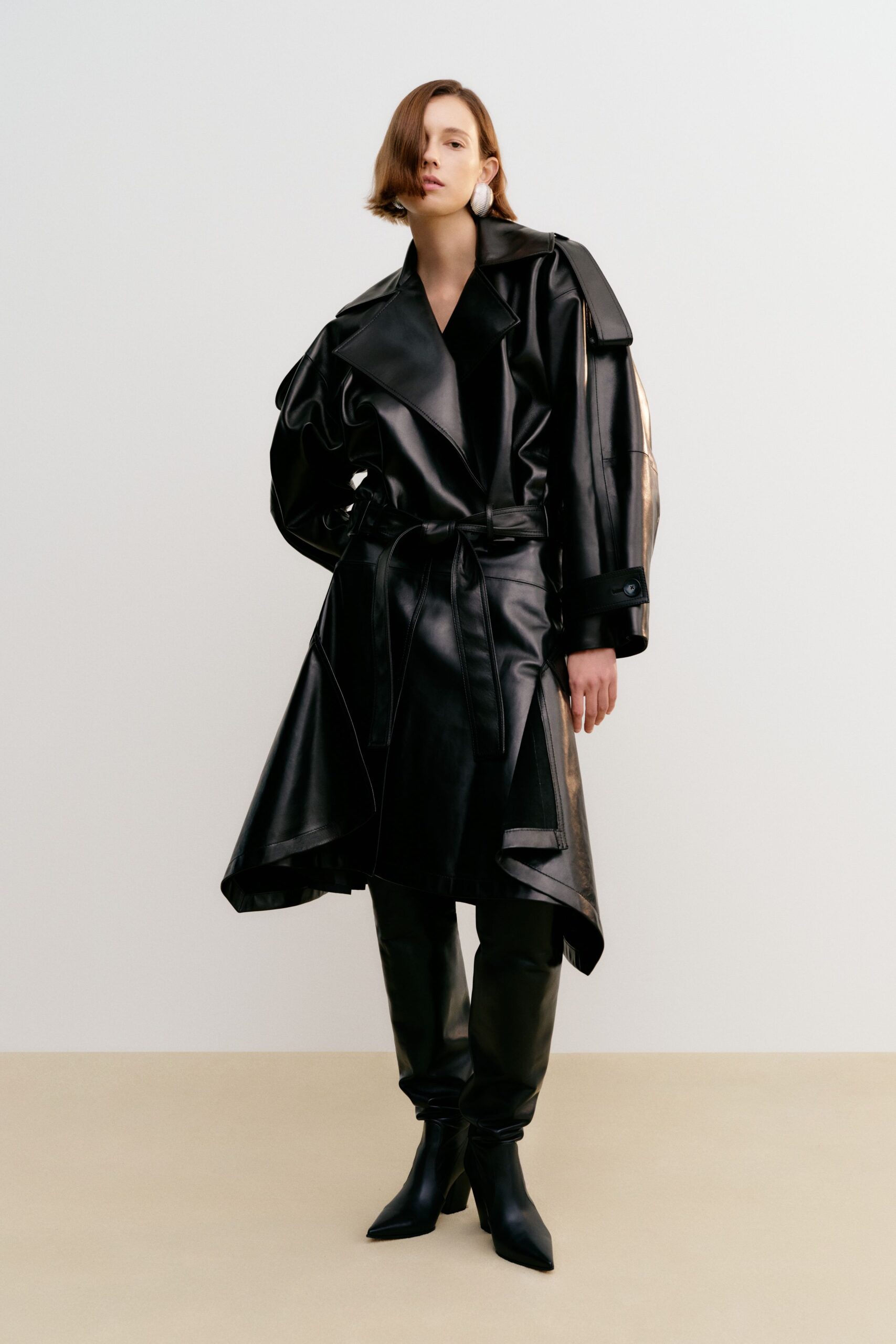 black leather long-sleeve collared oversized belted draped coat