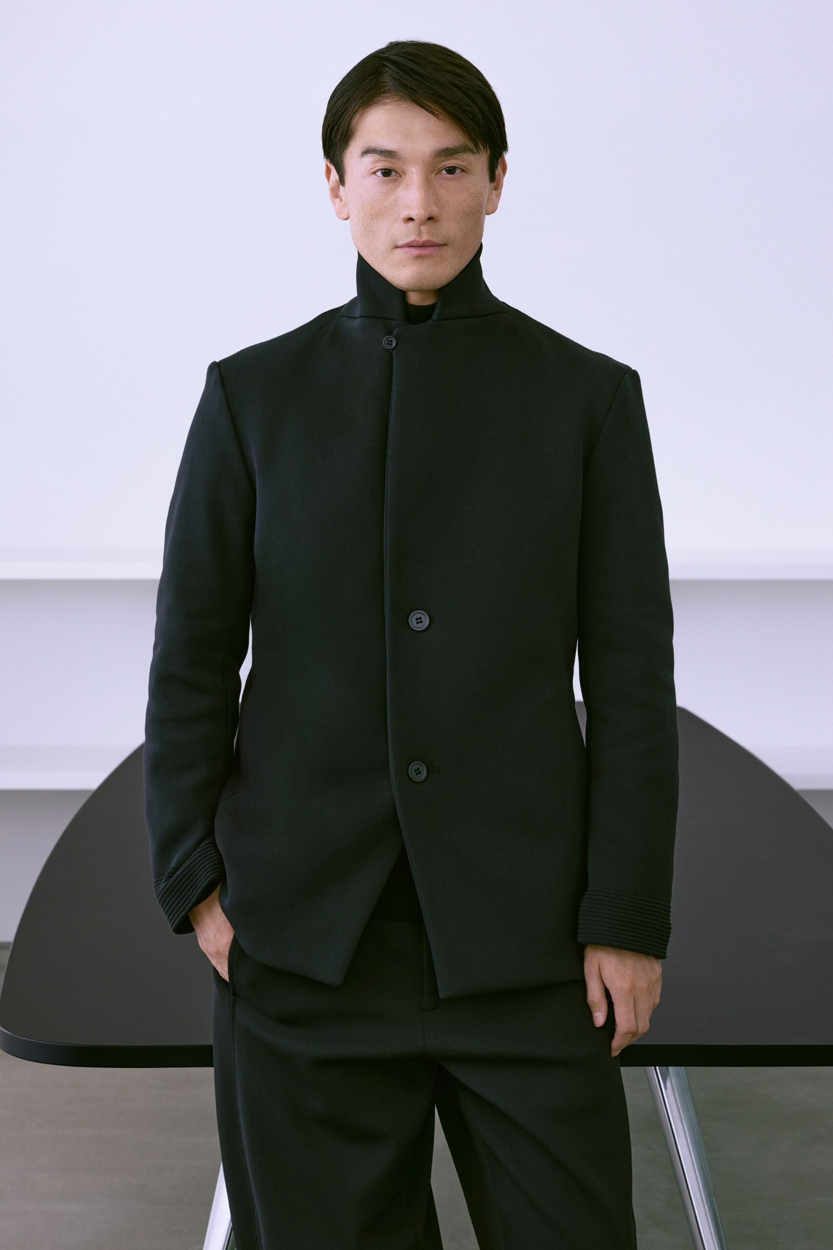 black structured jacket and tailored pants