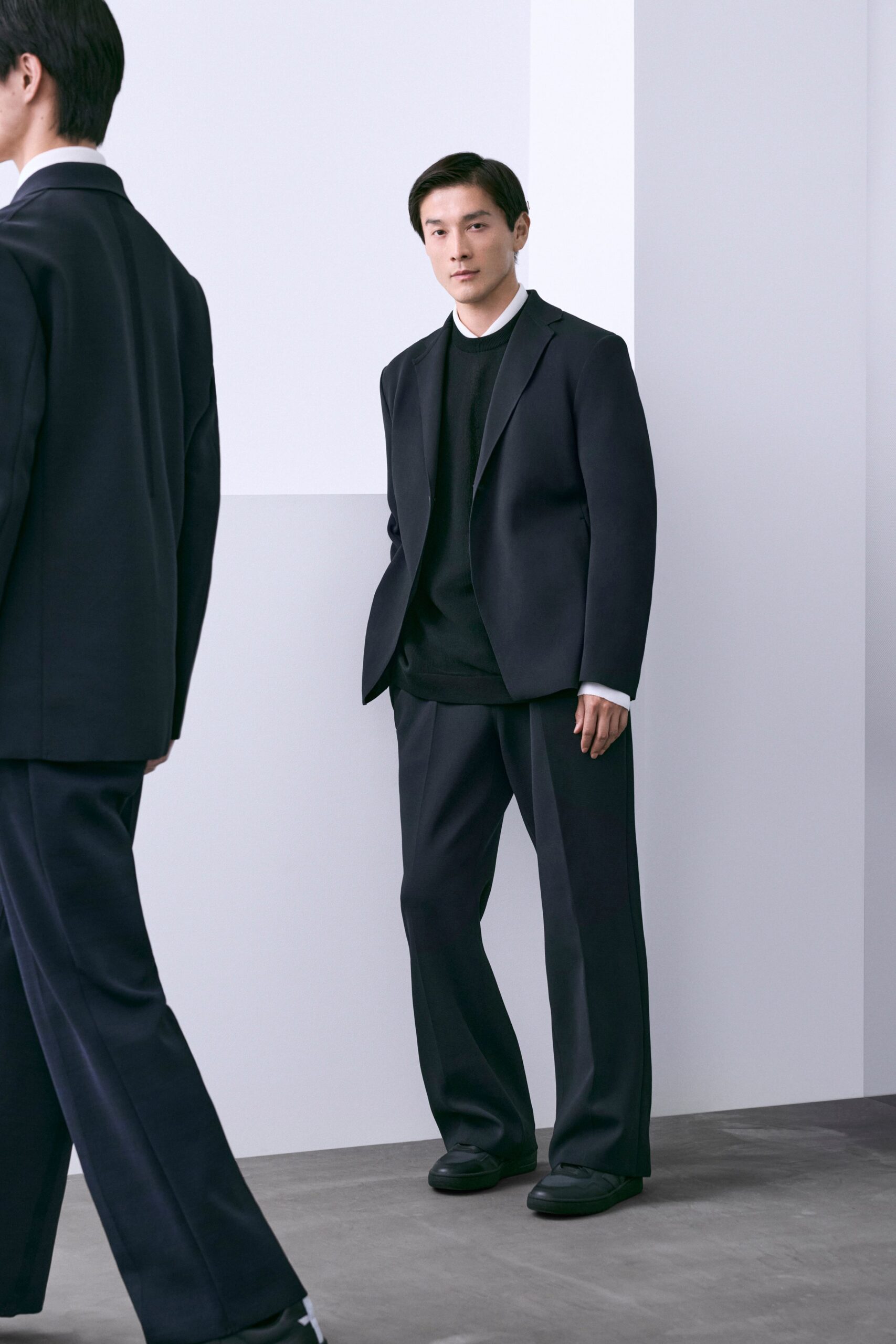 black tailored suit with sweater