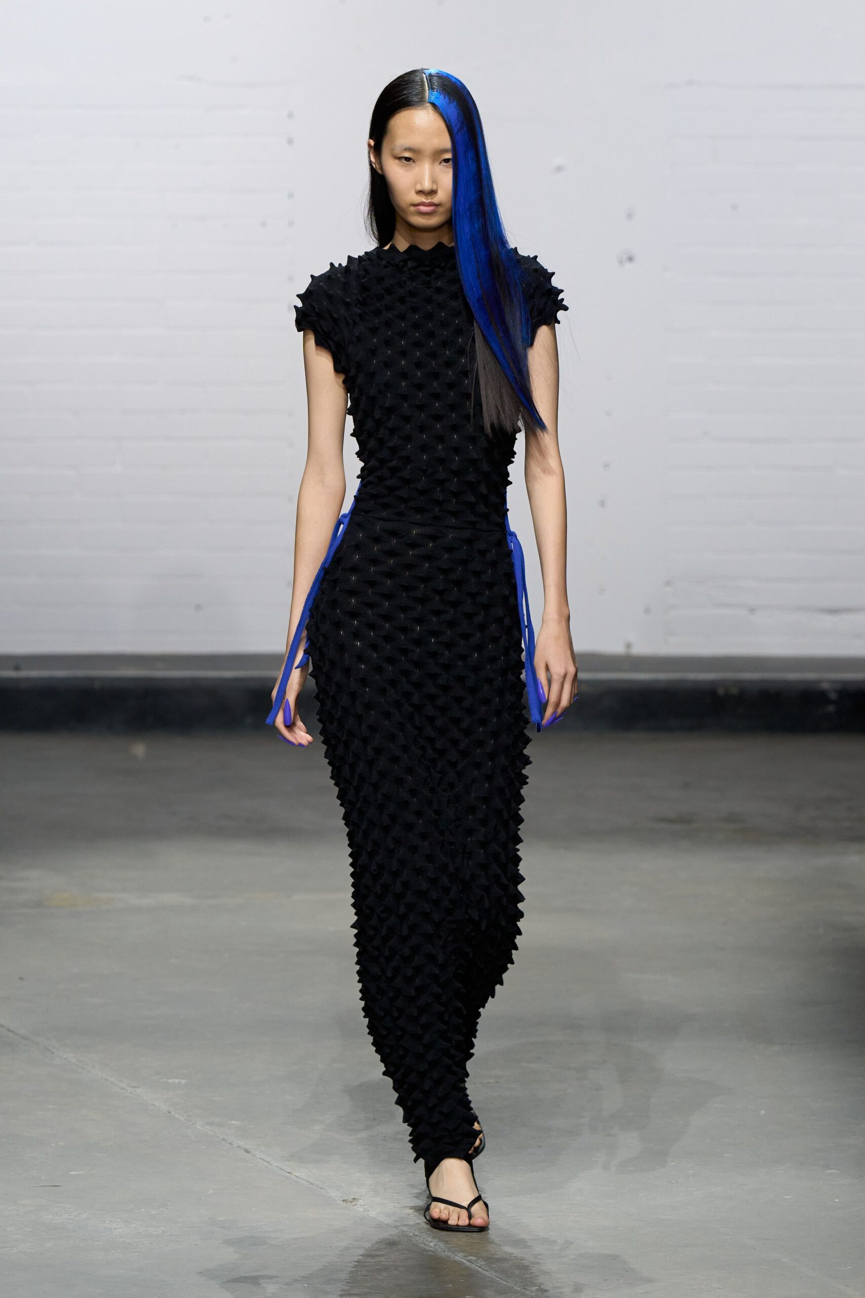 black fitted gown with pleats