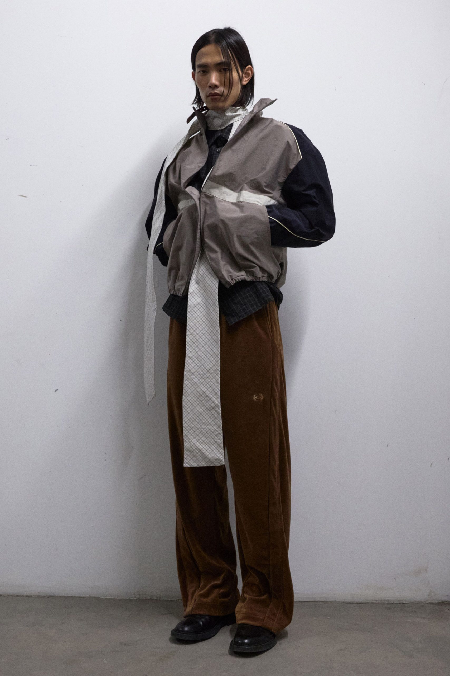 gray relaxed jacket with brown pants