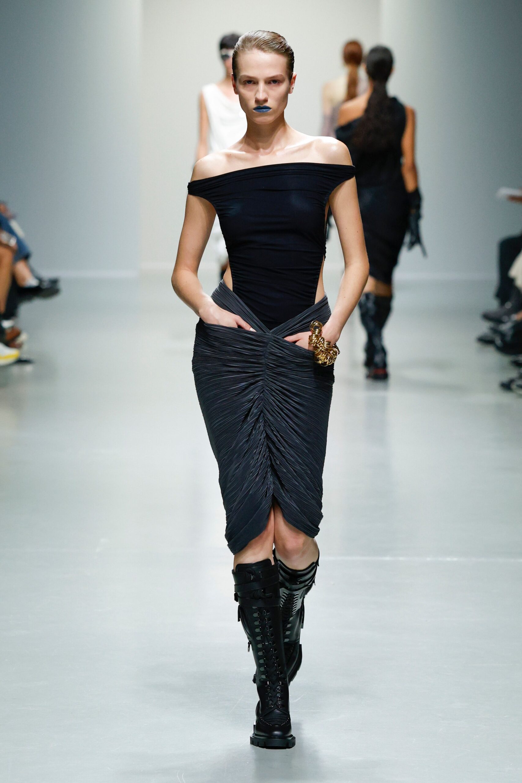 black off-shoulder ruched dress with boots