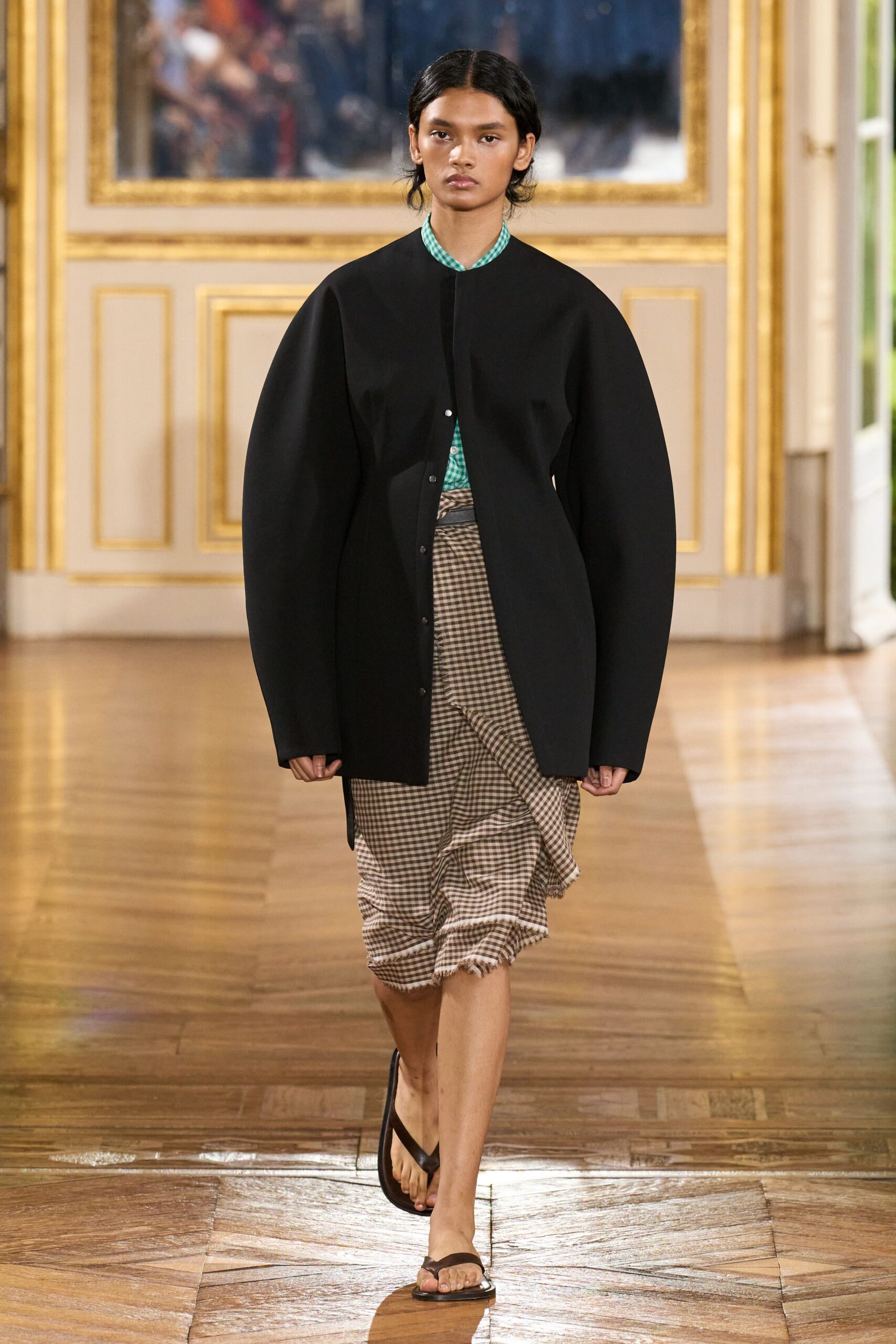 oversized black jacket with pleated skirt