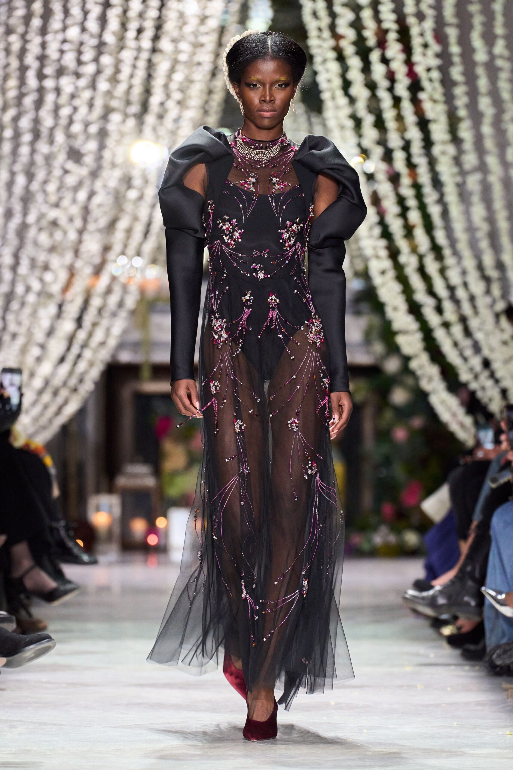 black embellished gown with red shoes