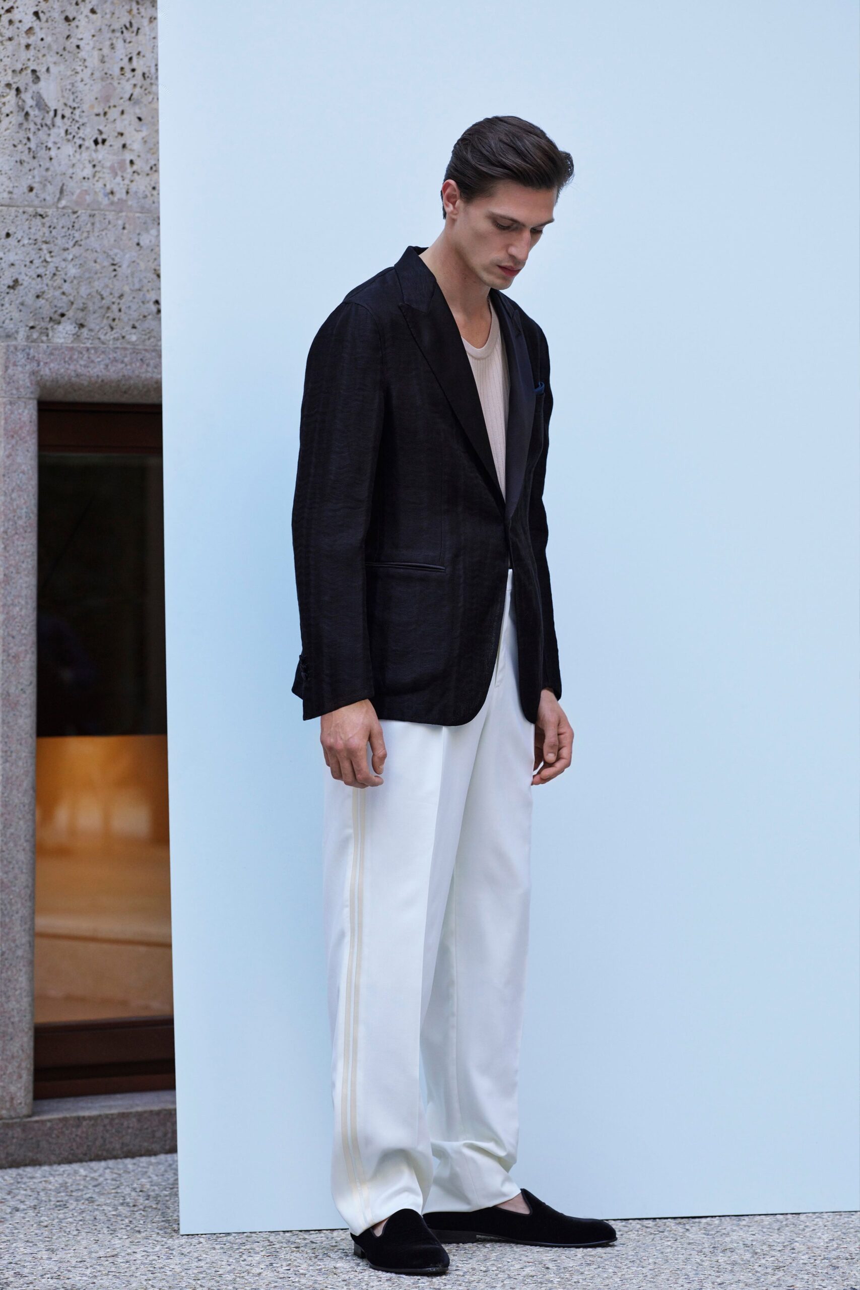 black blazer gray t-shirt white pants