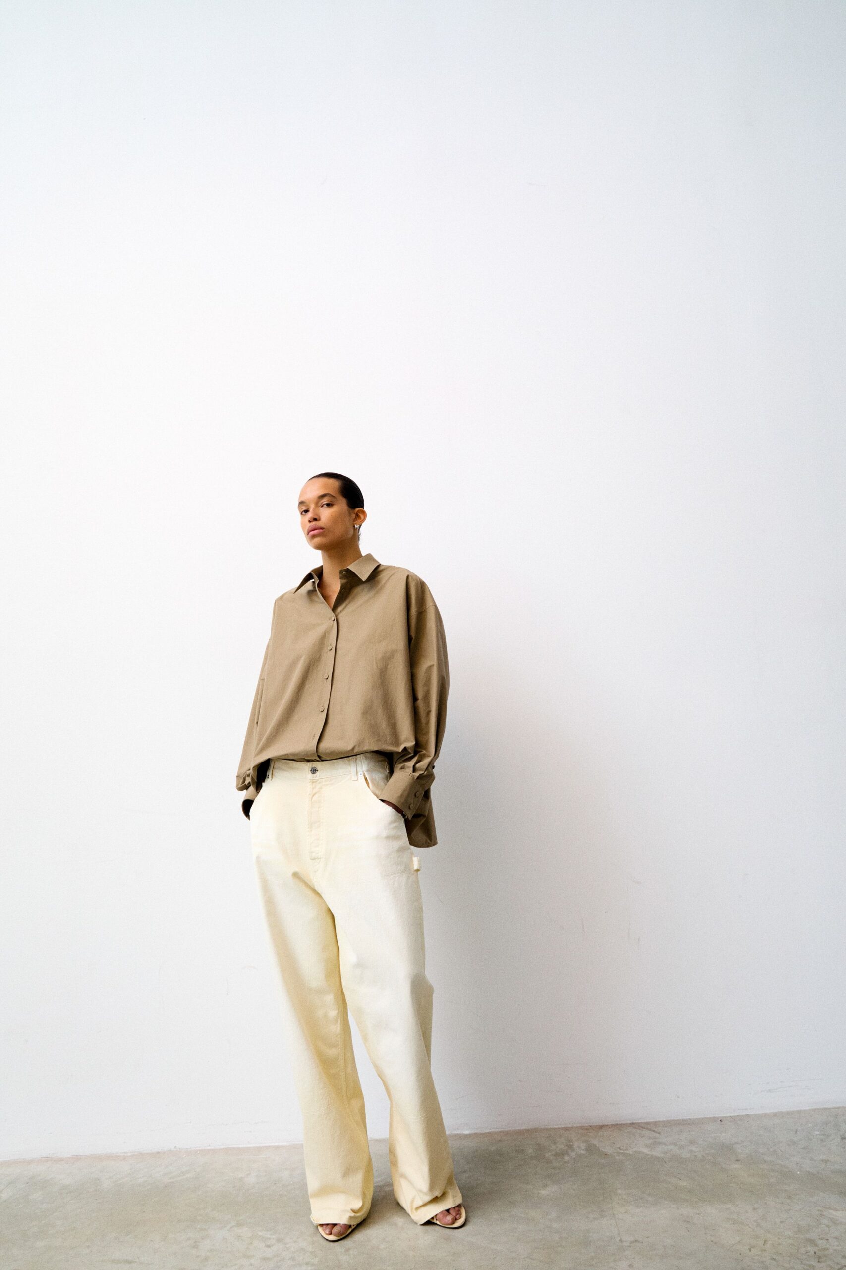 beige relaxed shirt with white pants