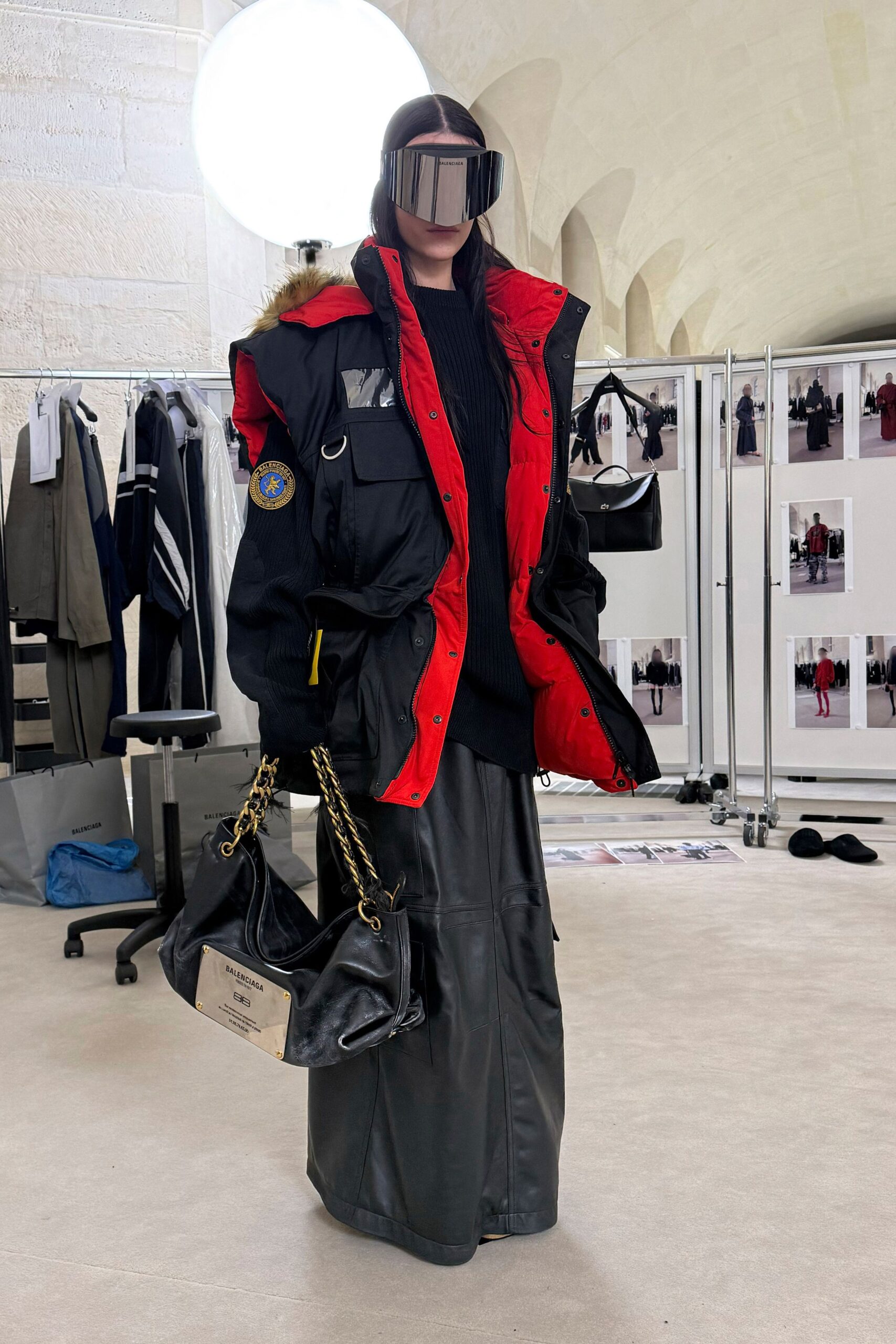 oversized black coat with leather skirt