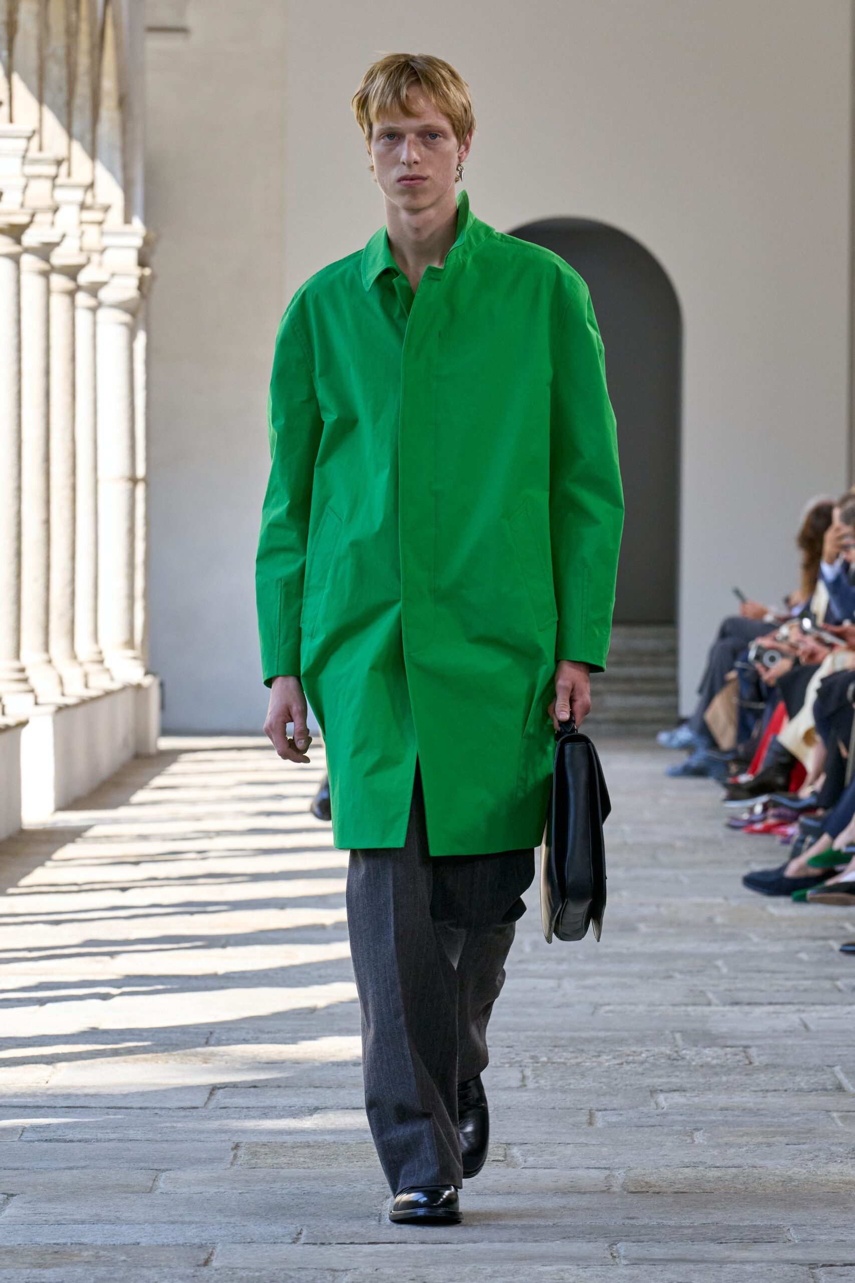 green coat gray pants black shoes