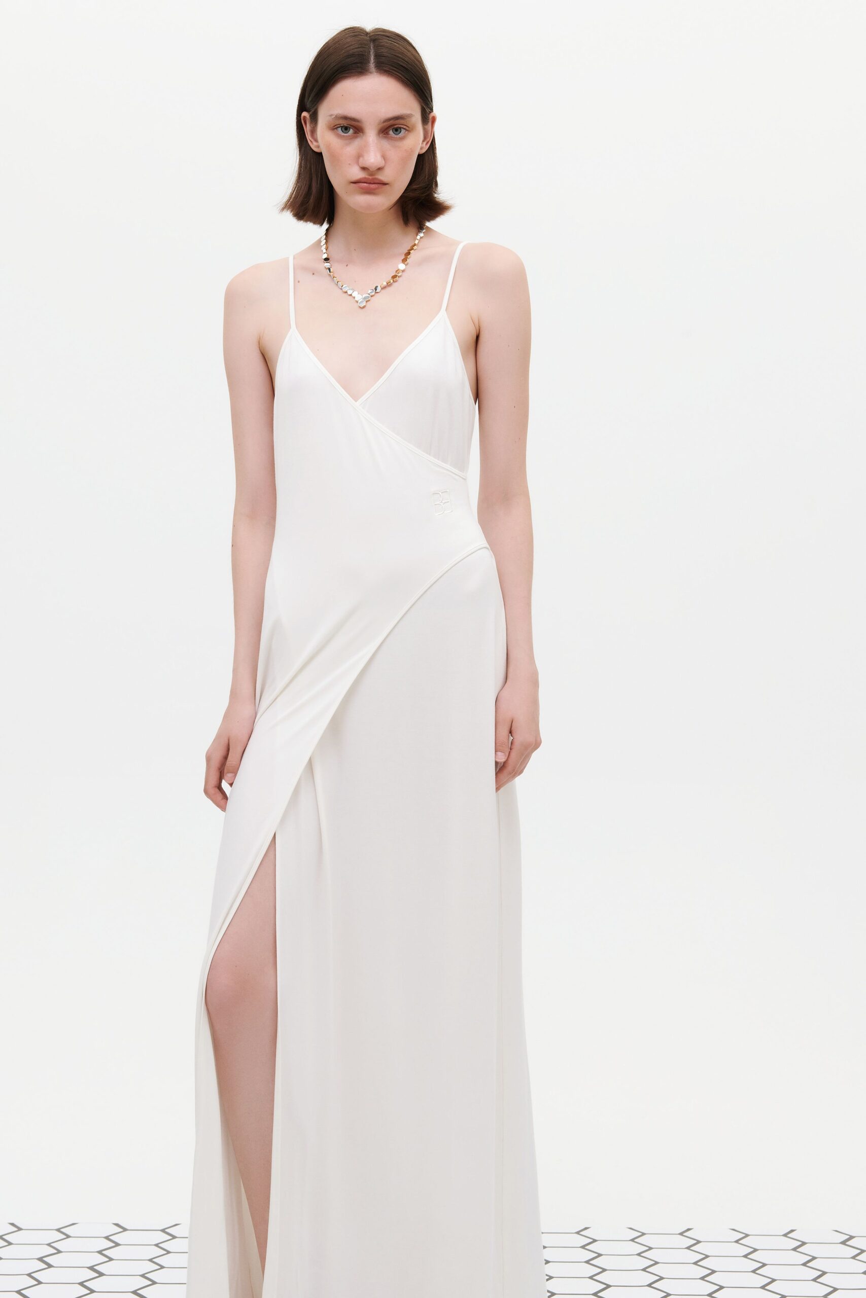 white silk sleeveless gown