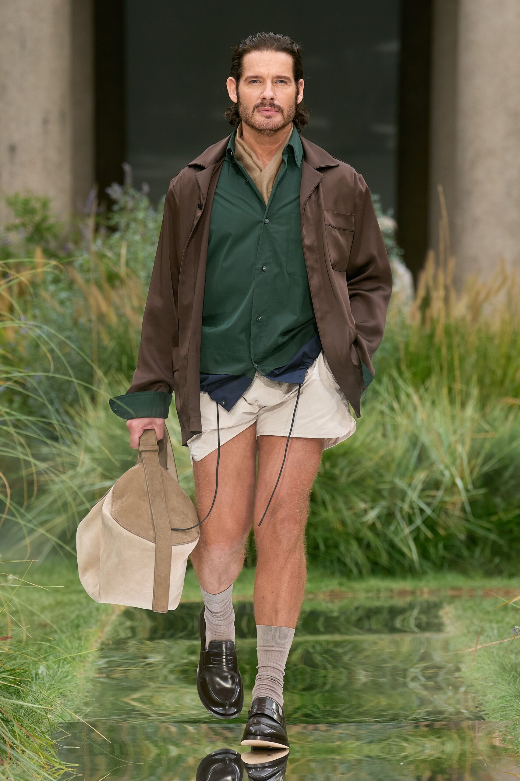 brown jacket green shirt beige shorts