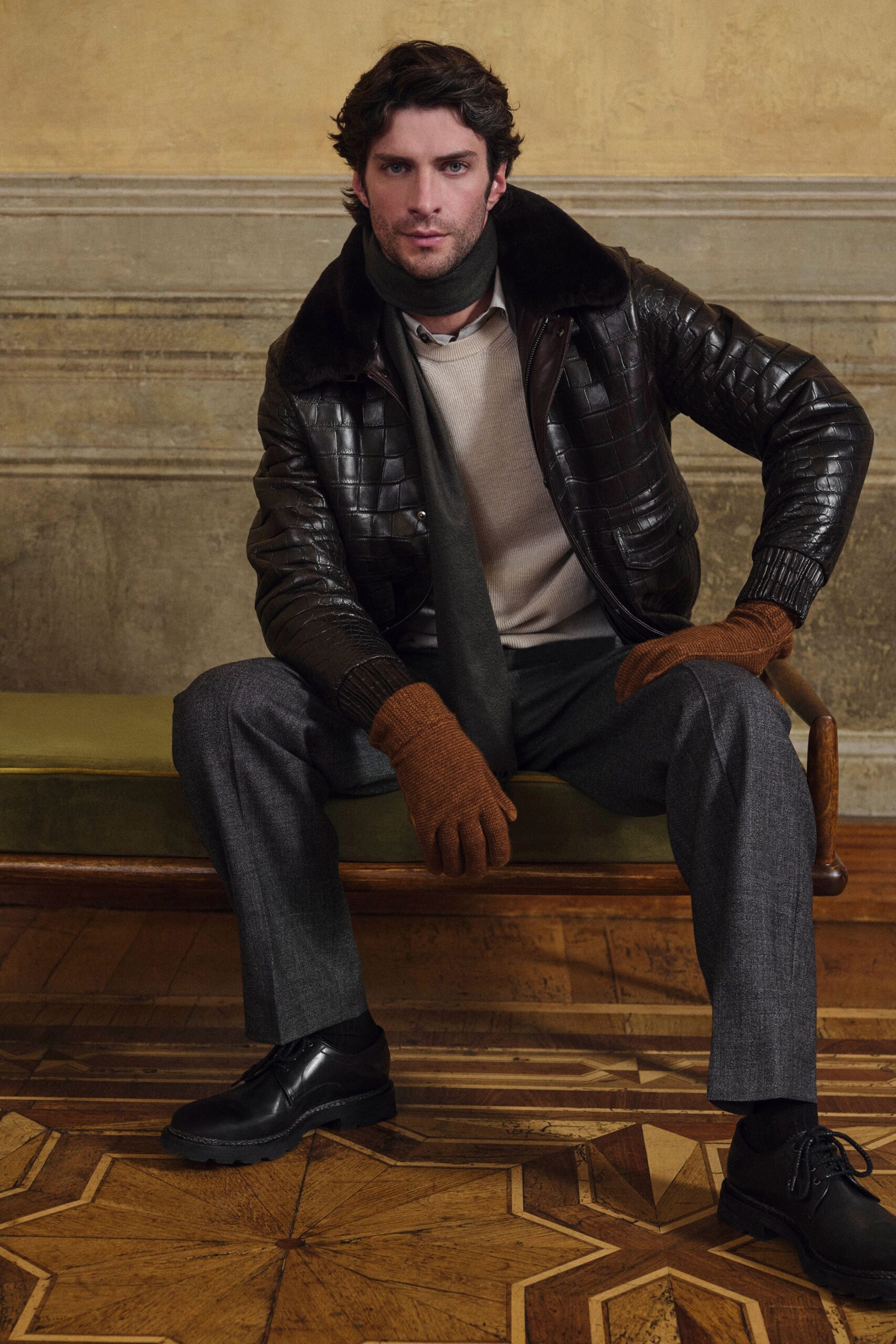 brown leather jacket with beige sweater