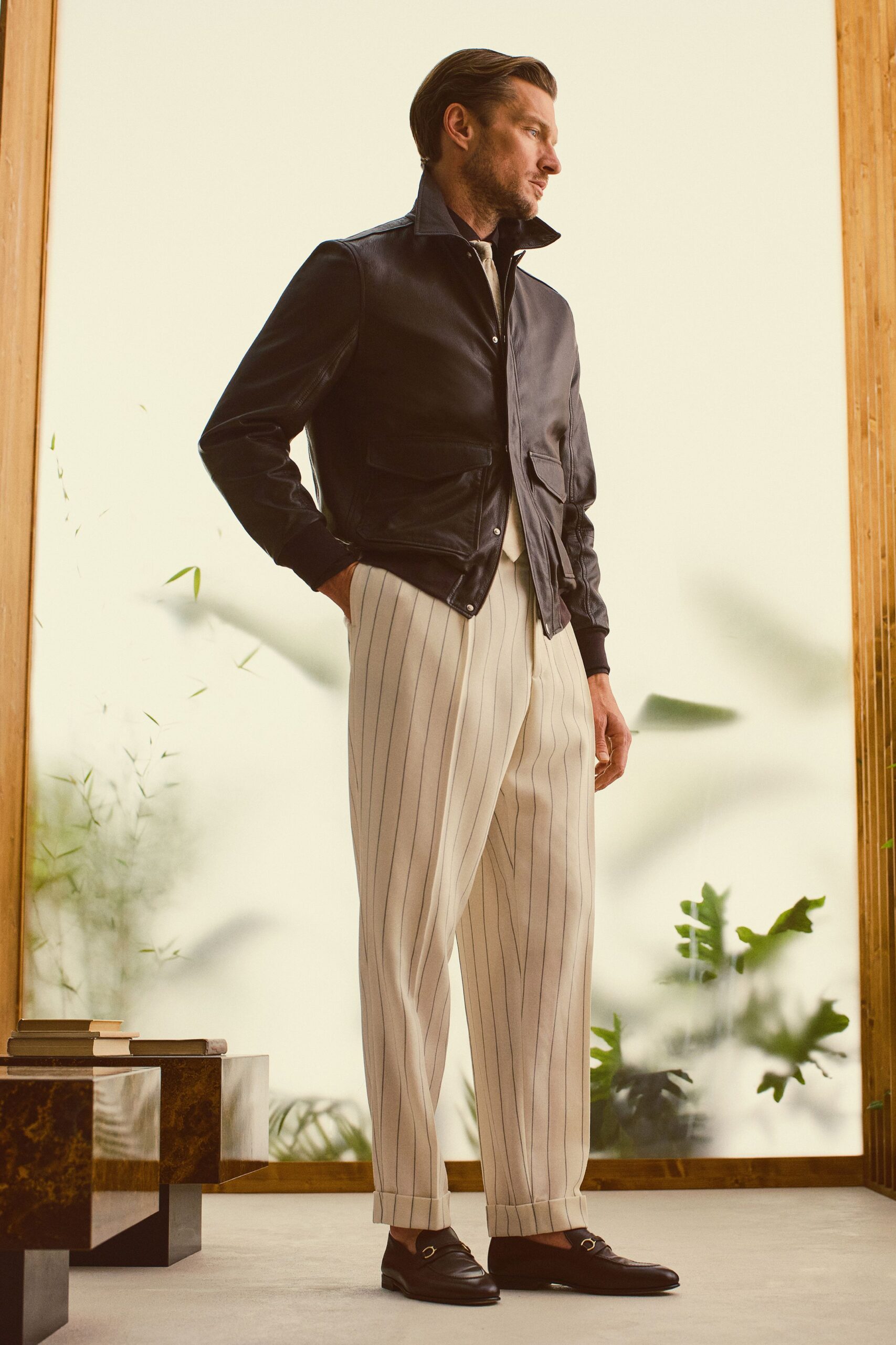 black leather jacket with striped pants