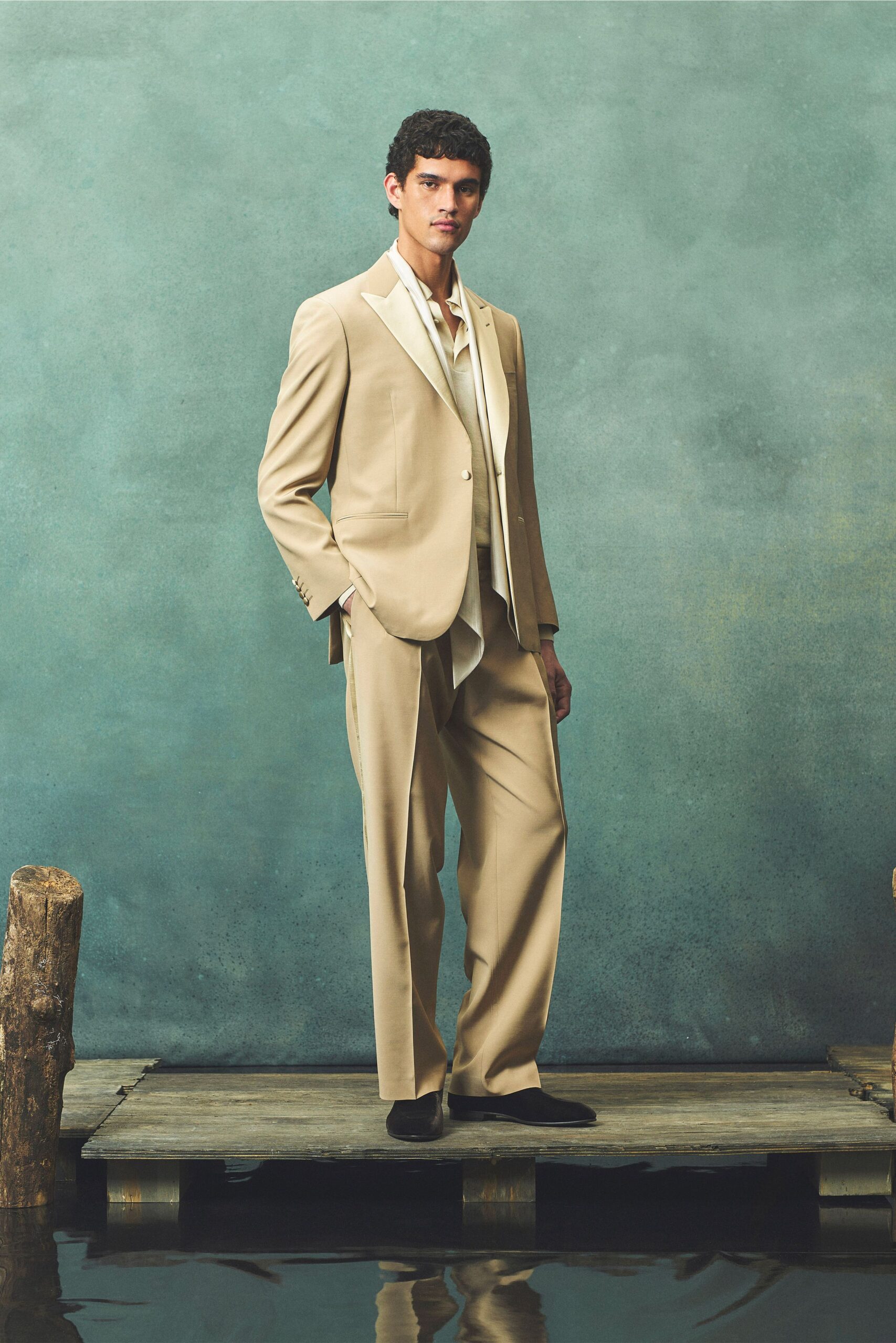 beige tailored suit with white shirt