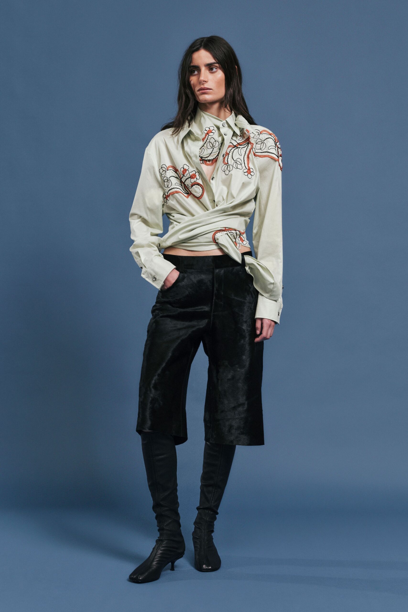 beige embroidered shirt with black pants