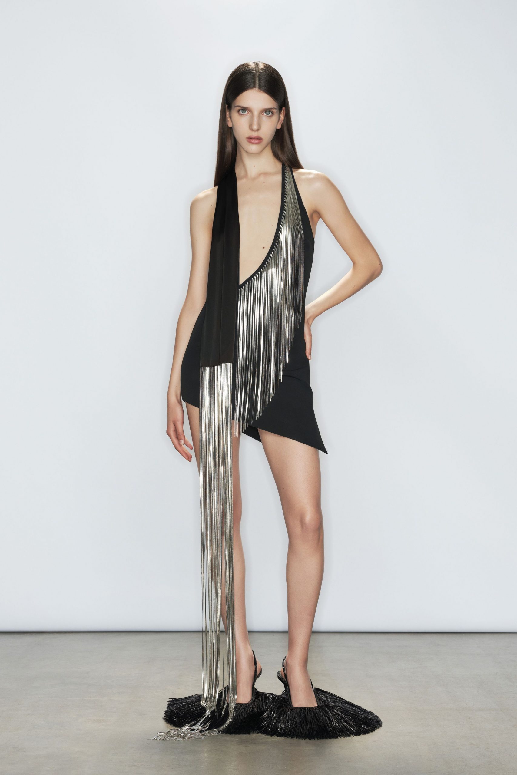 black fringed mini dress and shoes