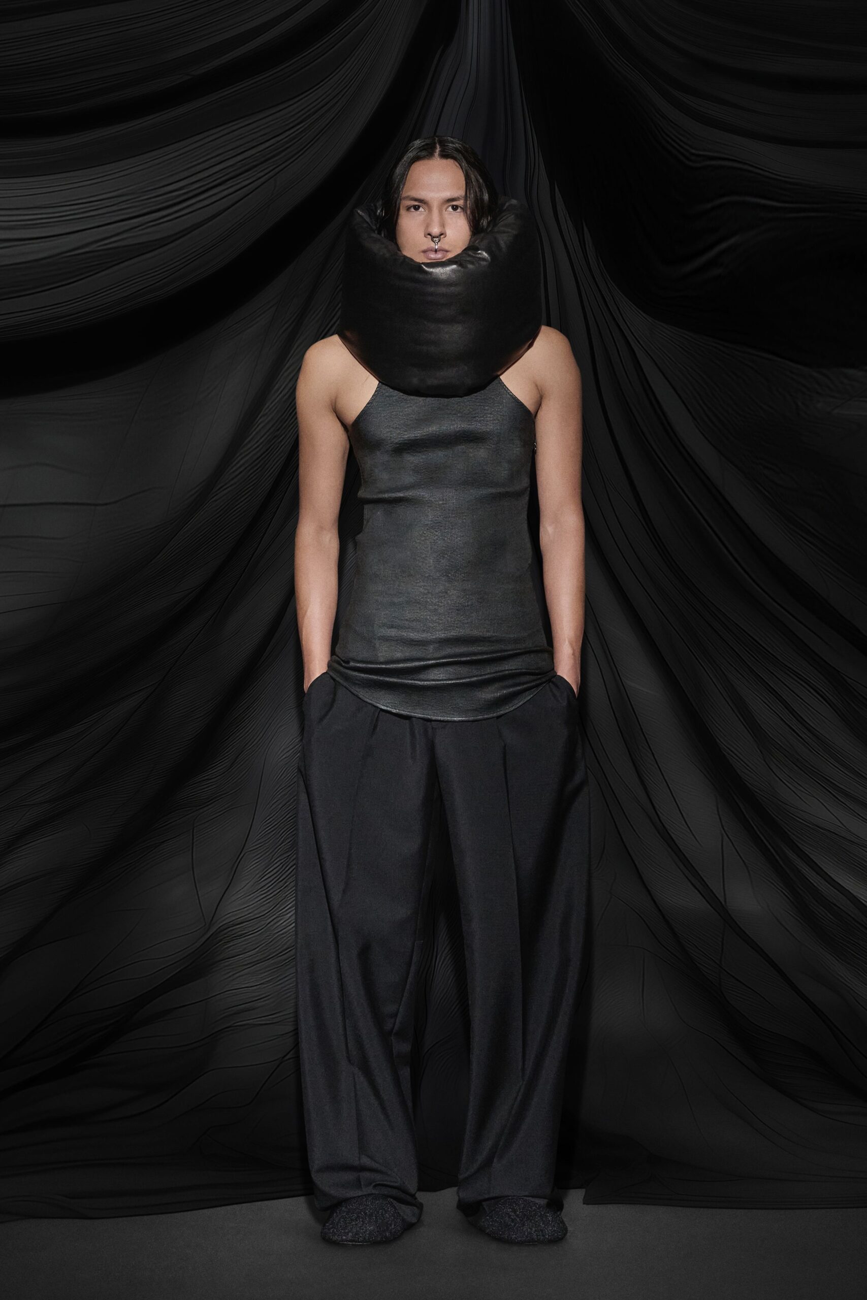 black leather sleeveless top and relaxed pants