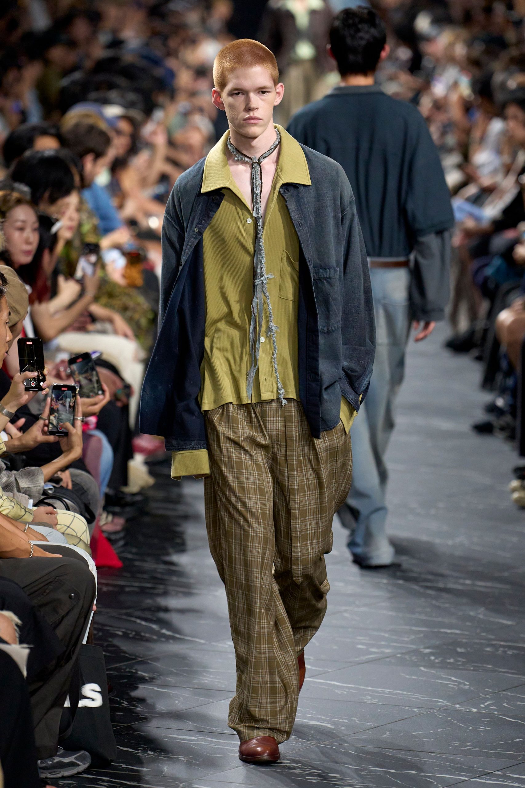 blue jacket green shirt brown pants