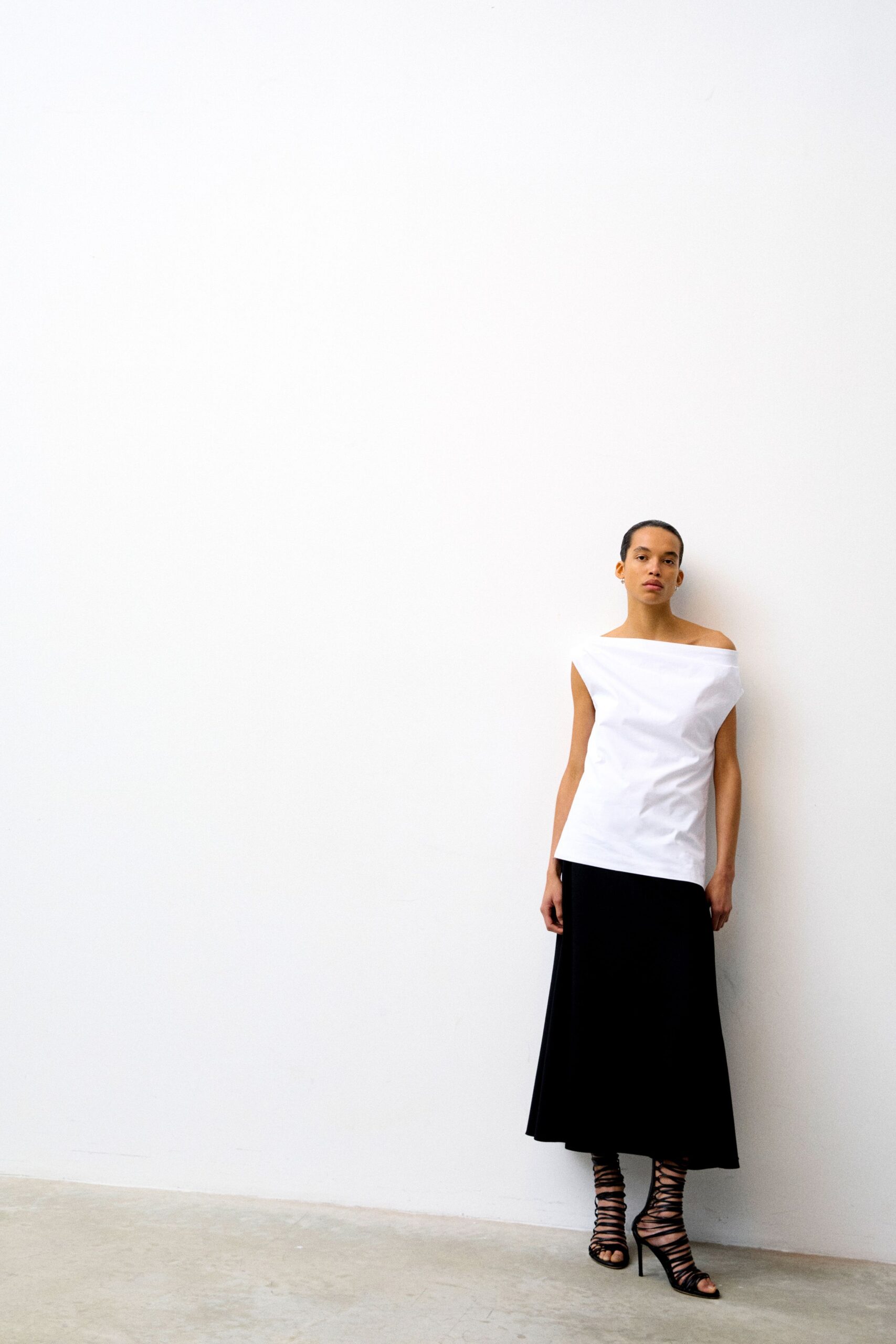 white off-shoulder top black midi skirt