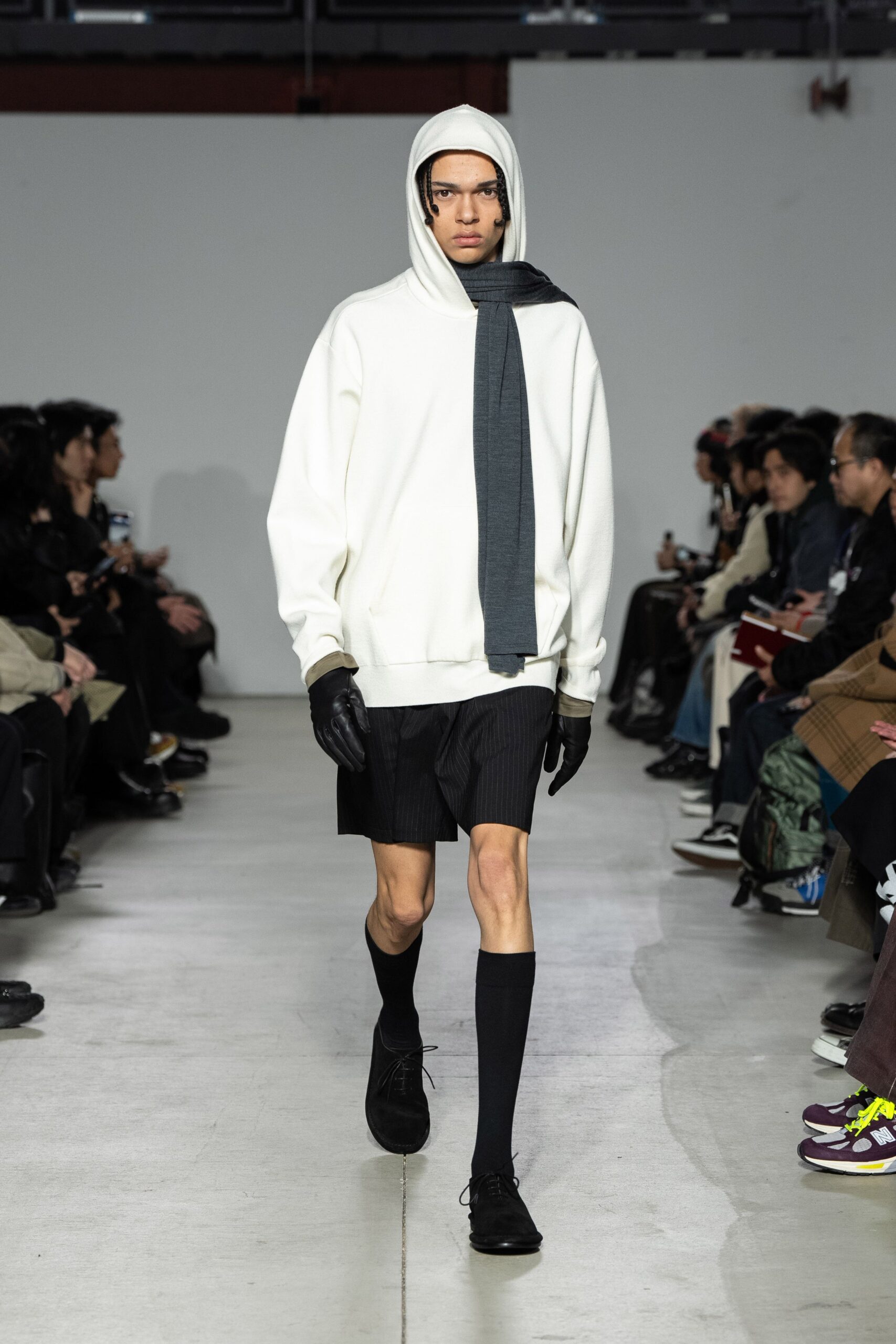 white relaxed hoodie with black shorts