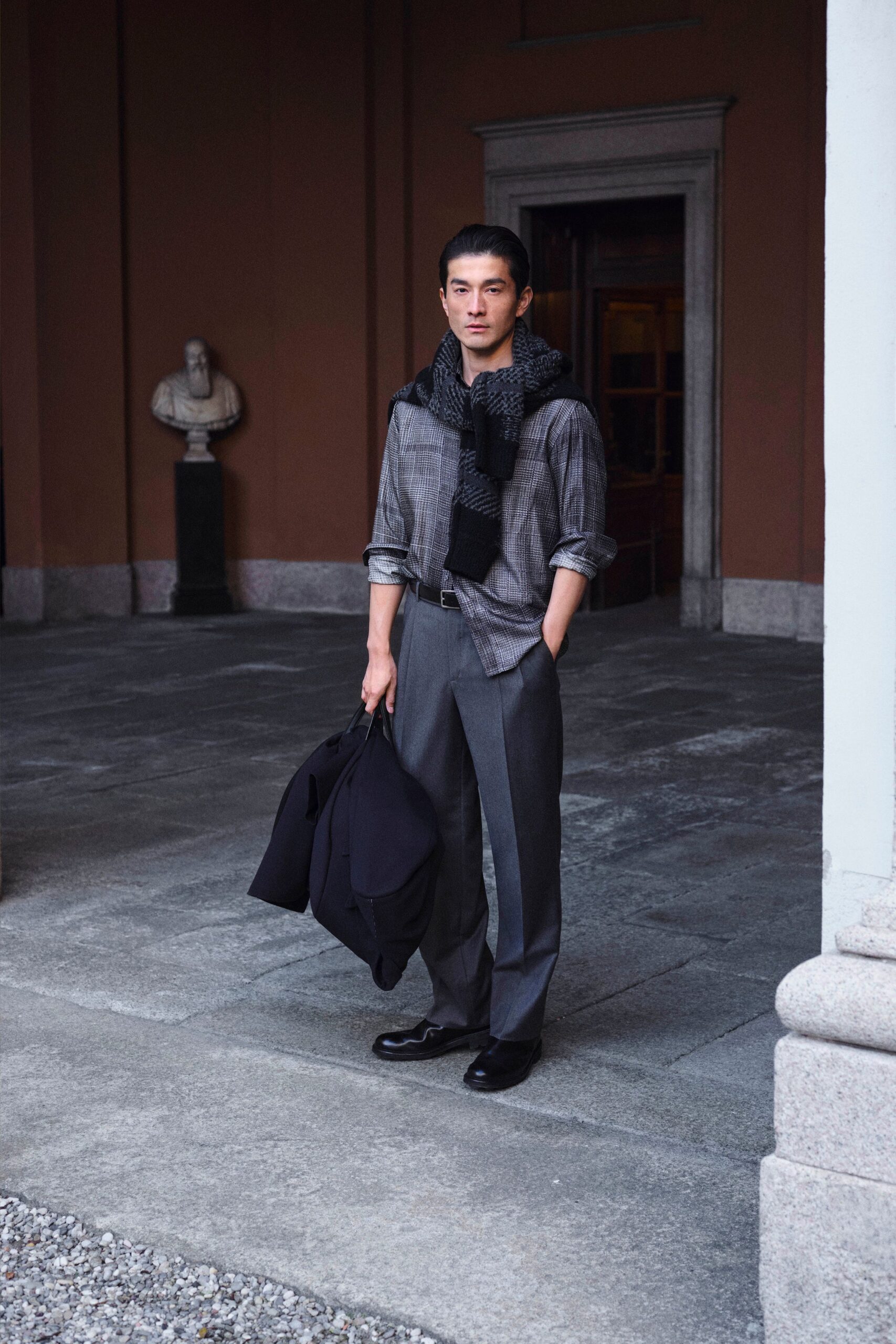 black and white checked shirt with gray pants