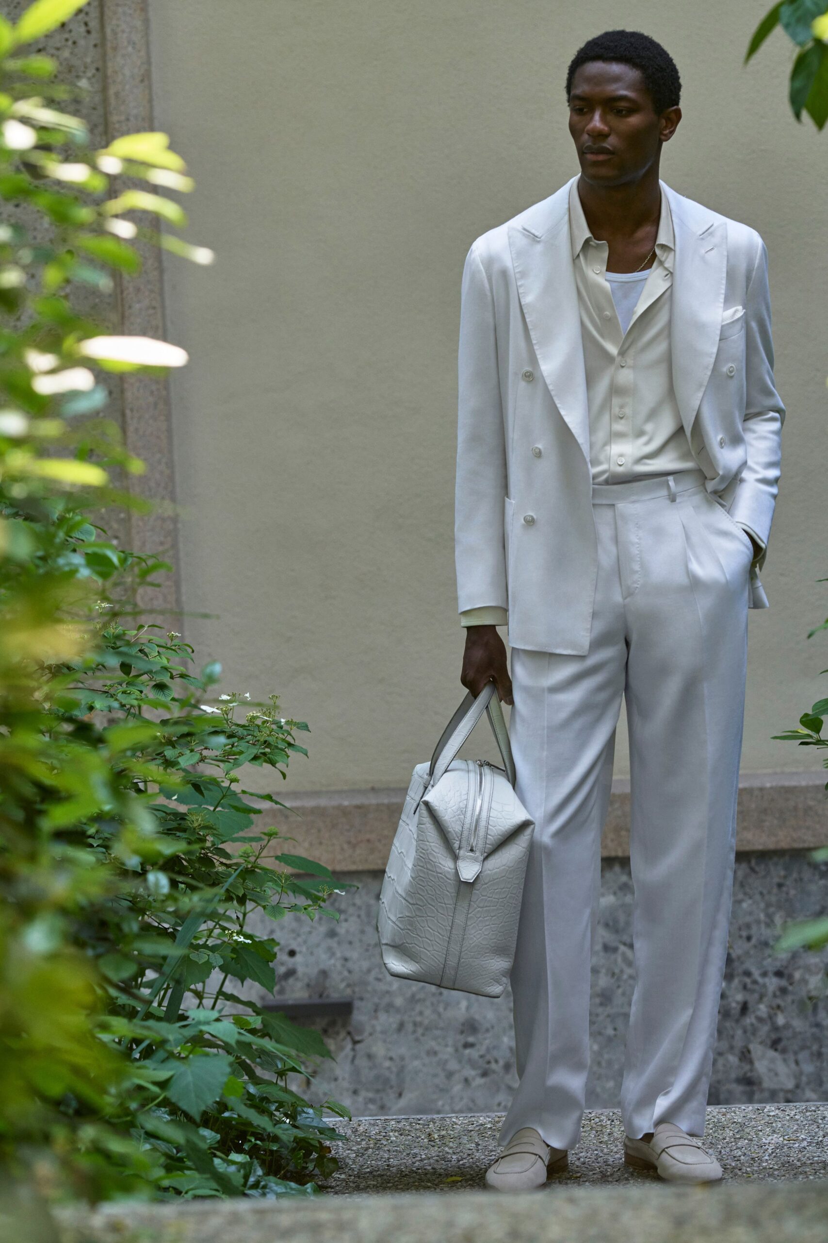 white tailored suit with bag