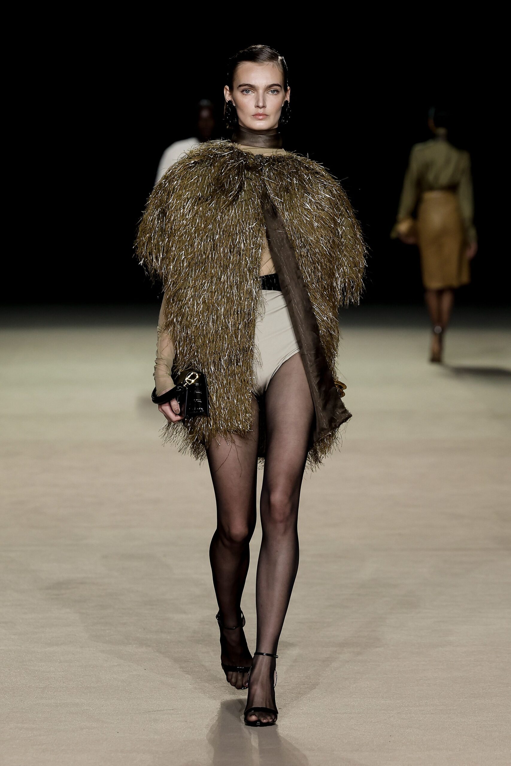 gold fringed cape with black top