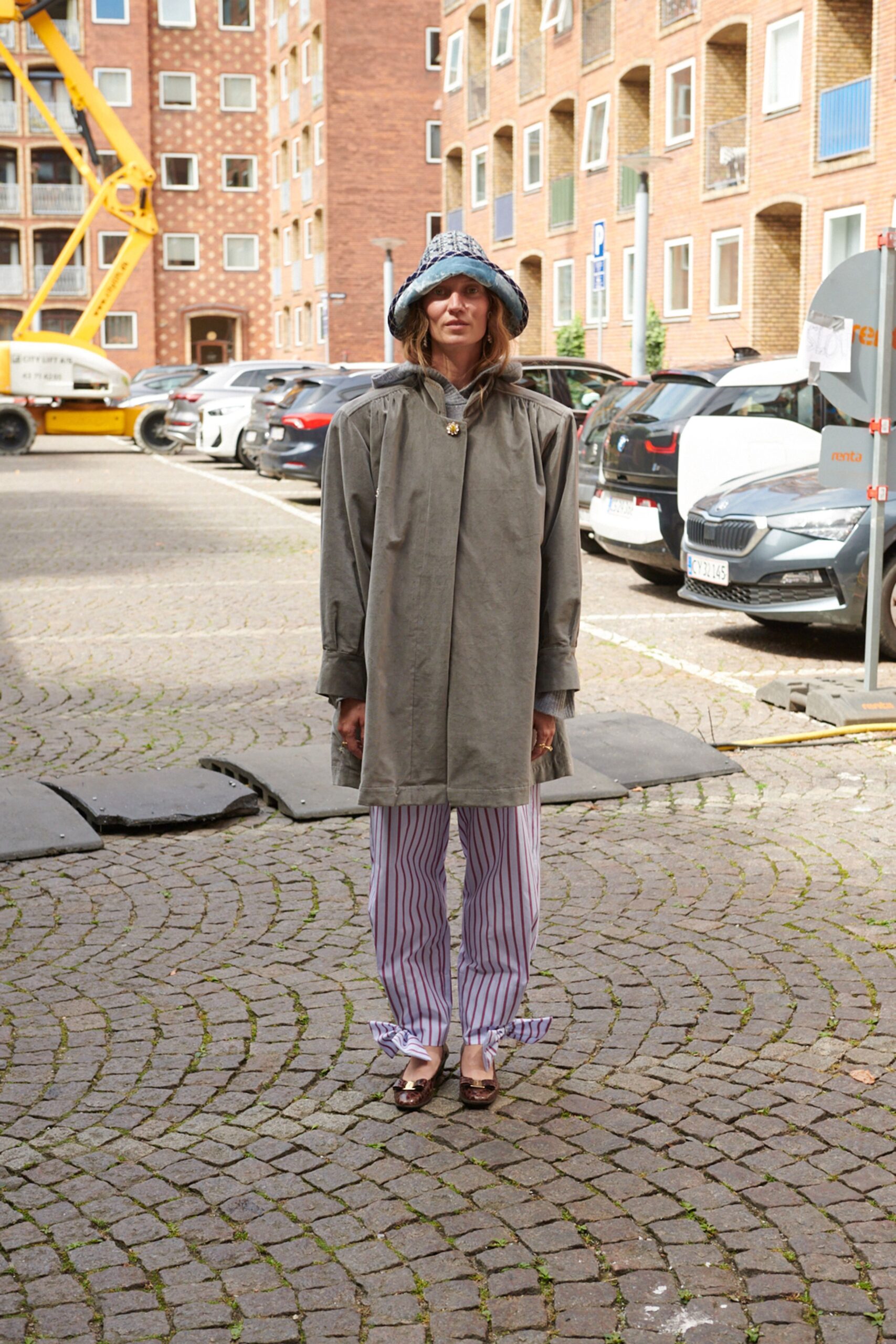 gray coat with striped pants