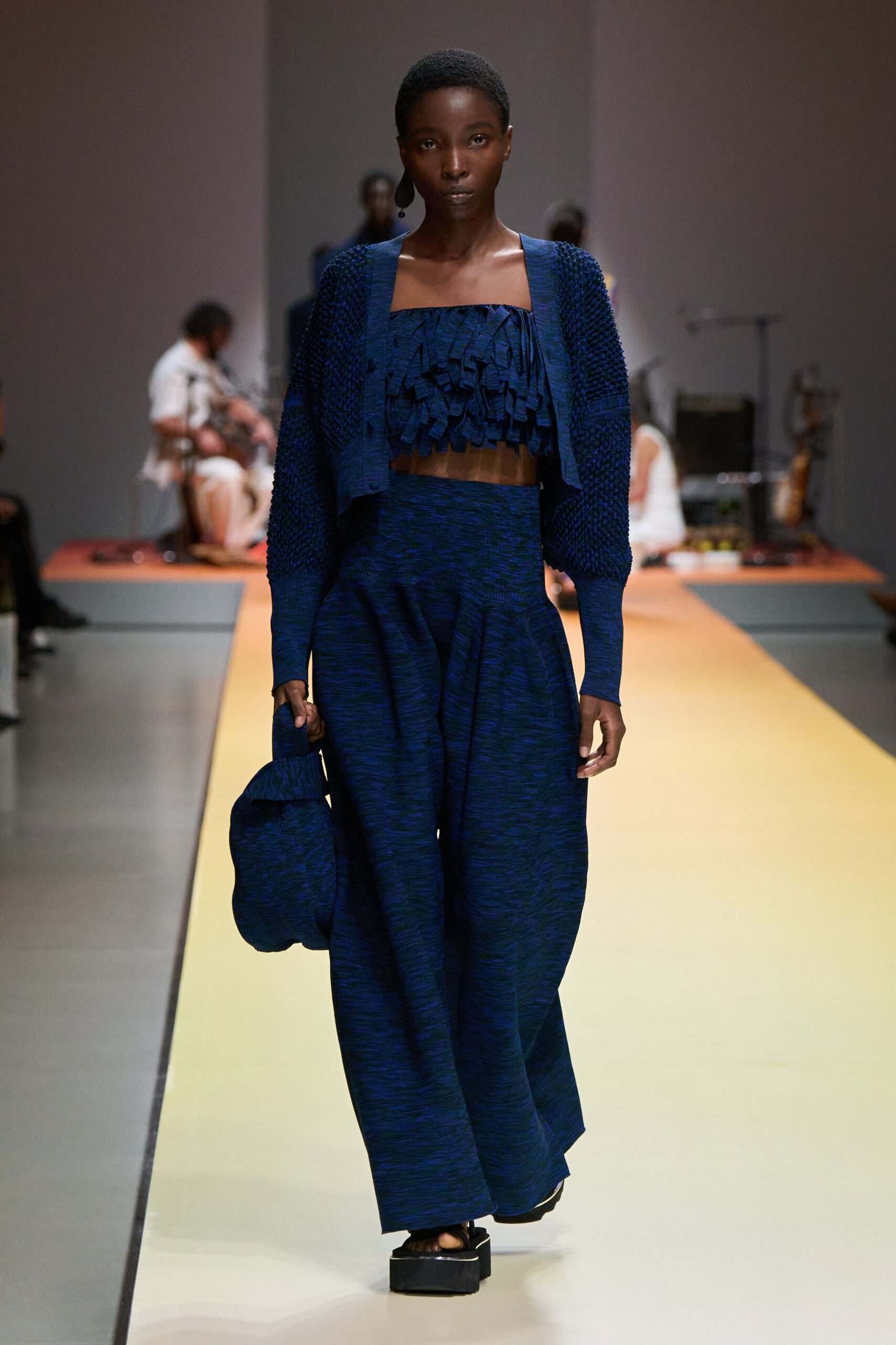 blue ruffled top and wide-leg pants