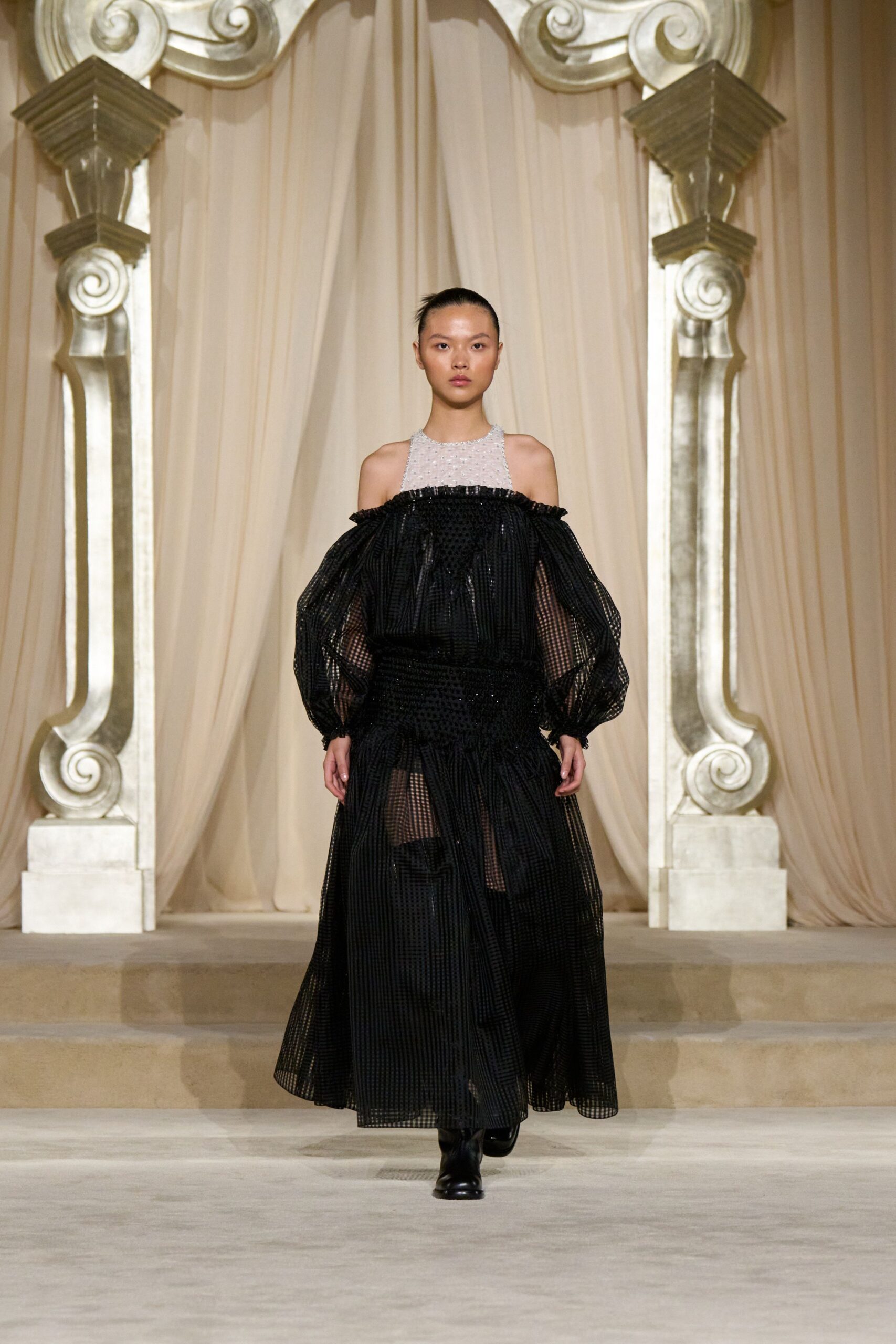 black pleated off-shoulder gown with boots