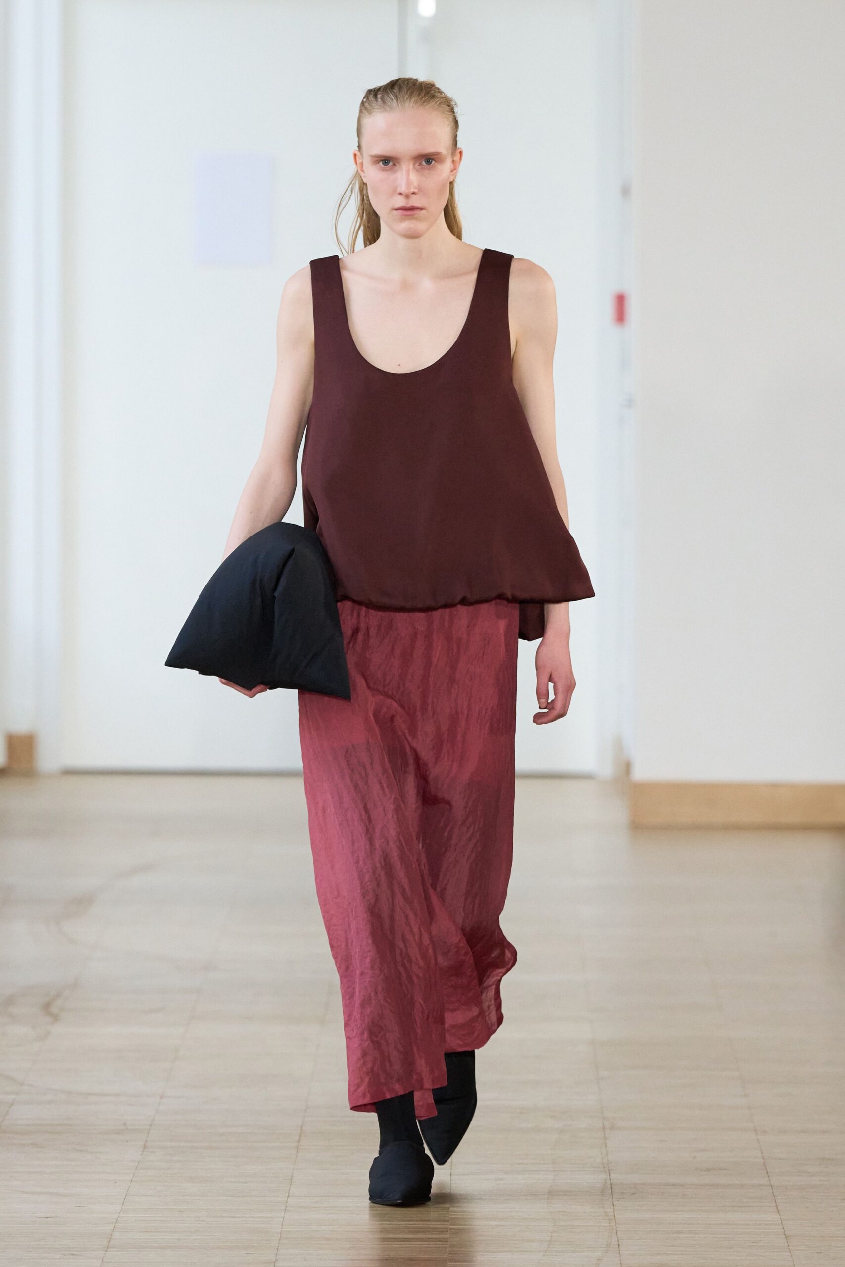 brown relaxed top with red maxi skirt