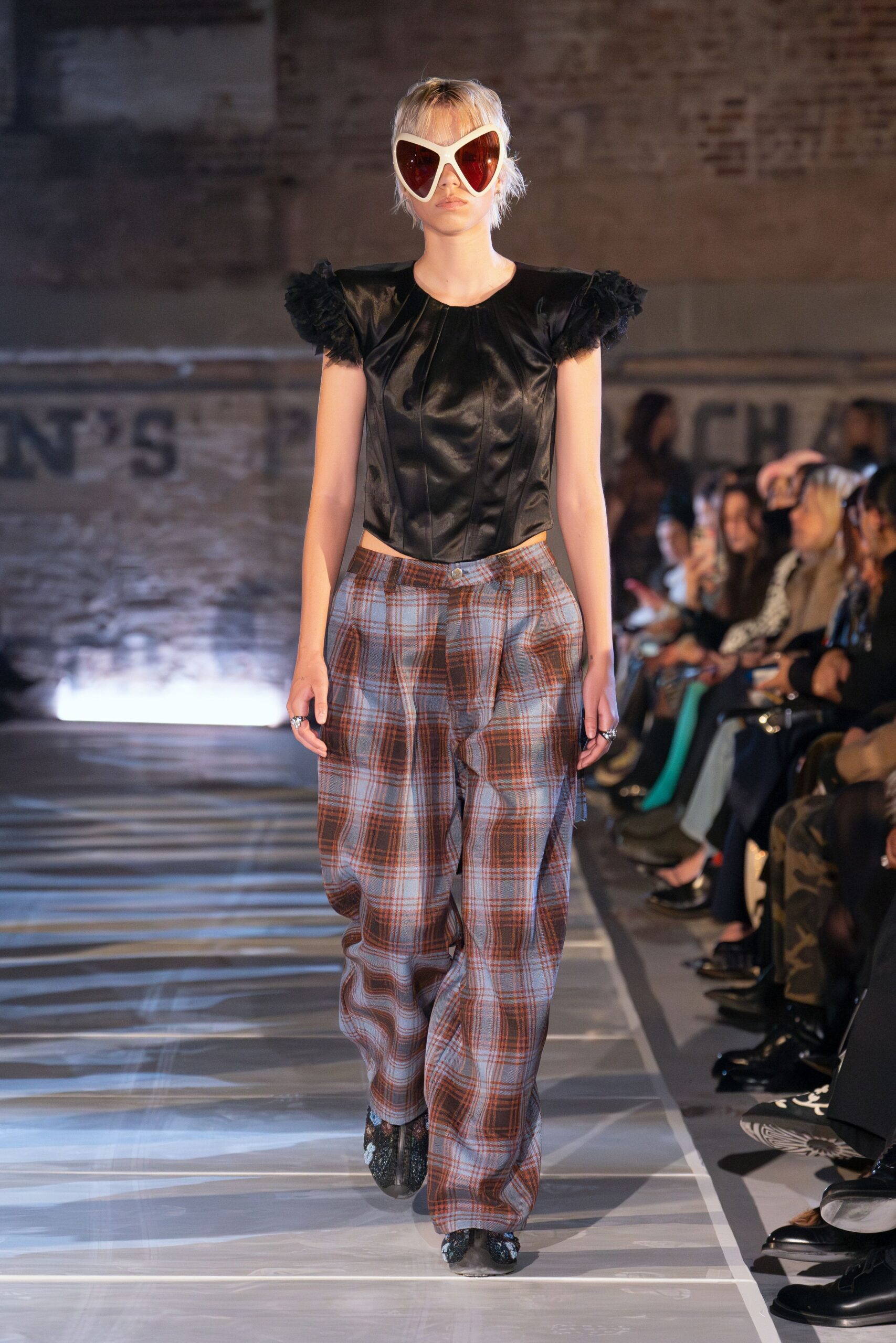 black silk fitted top with plaid pants