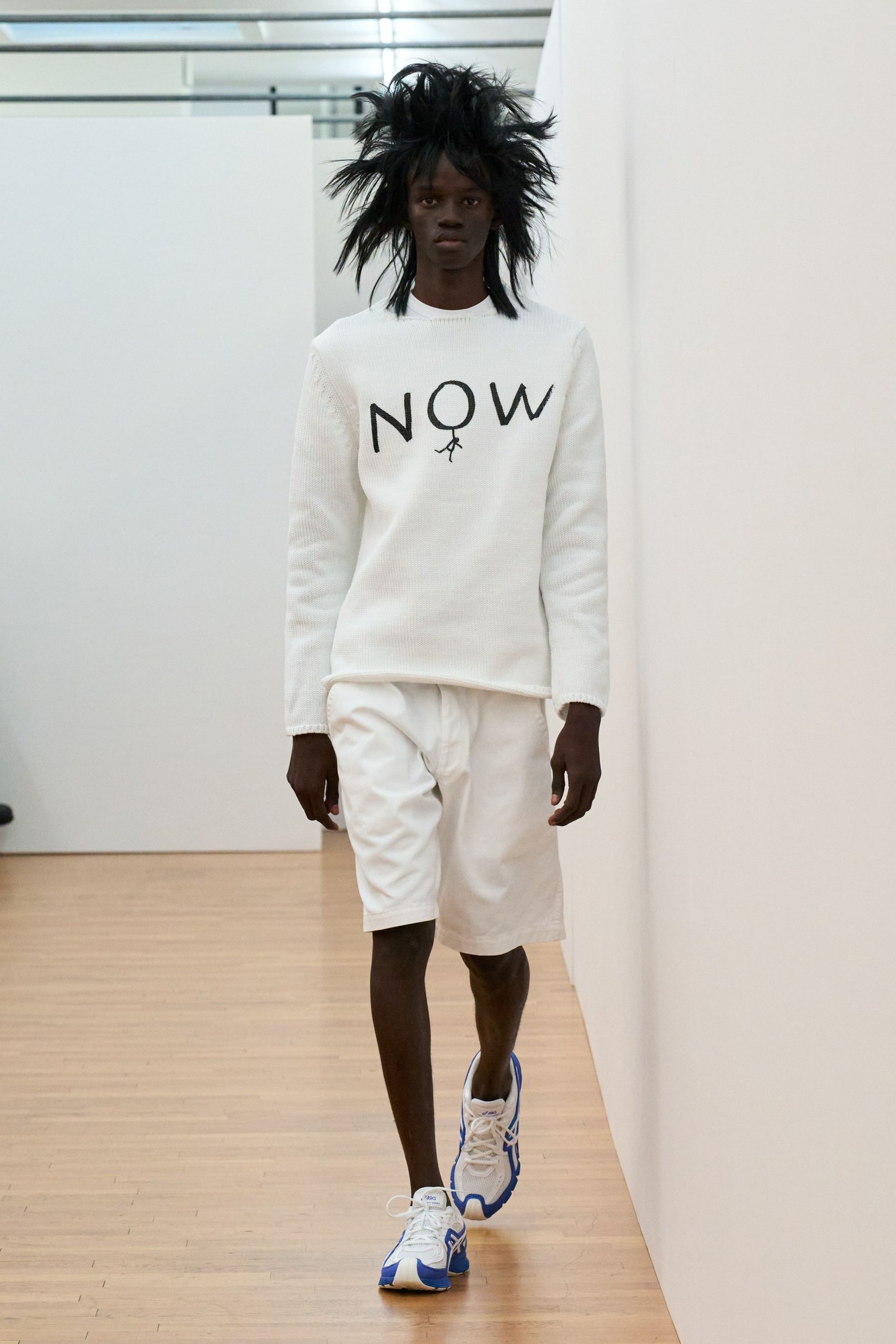 white relaxed sweater with shorts