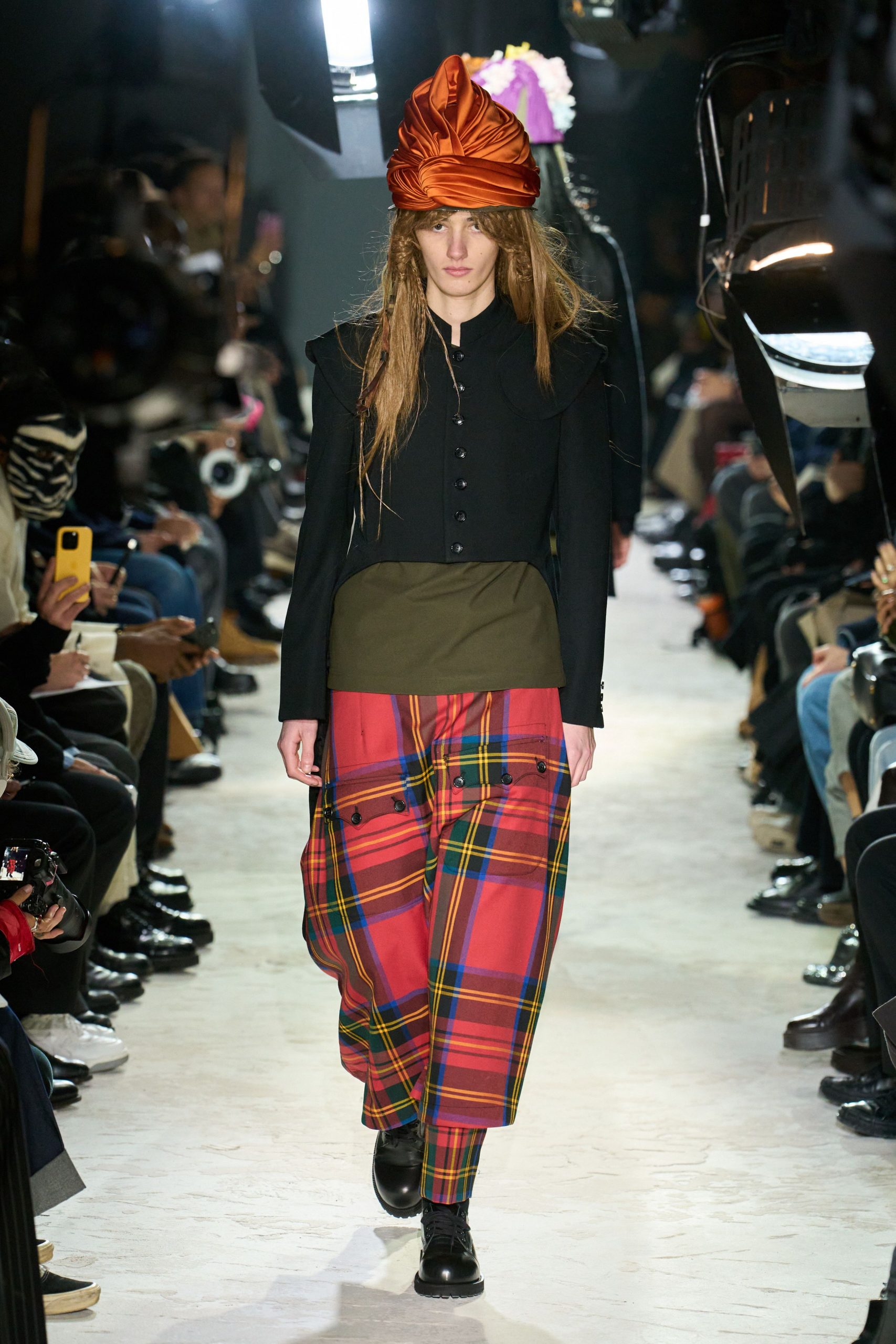 black jacket green top plaid pants