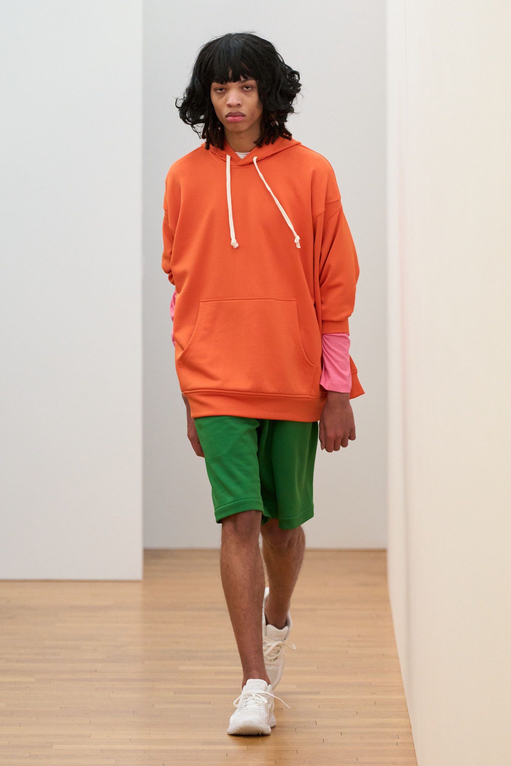 orange oversized hoodie with green shorts