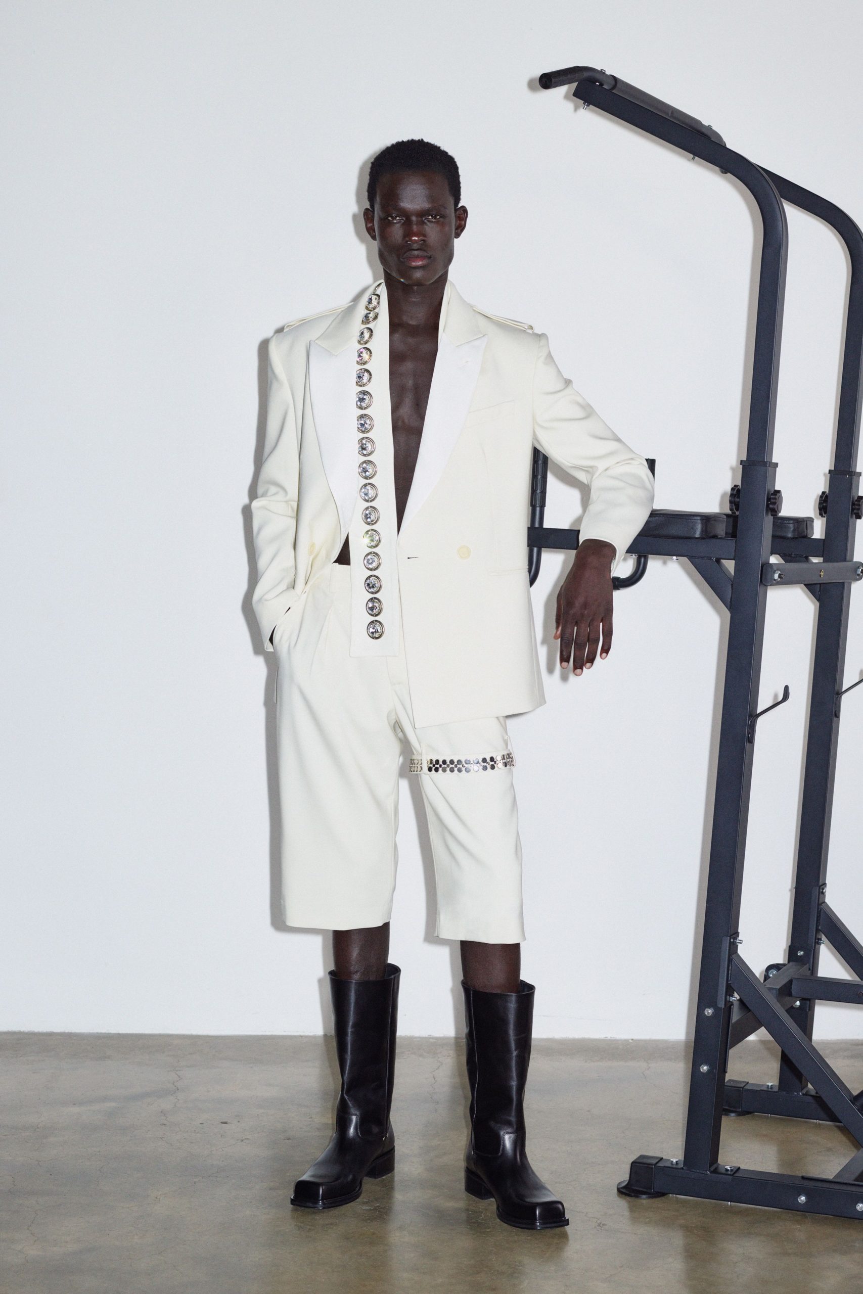 white tailored suit with black boots