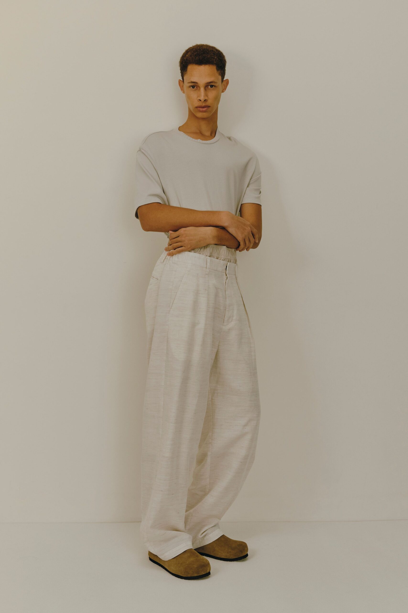 beige t-shirt white wide-leg pants