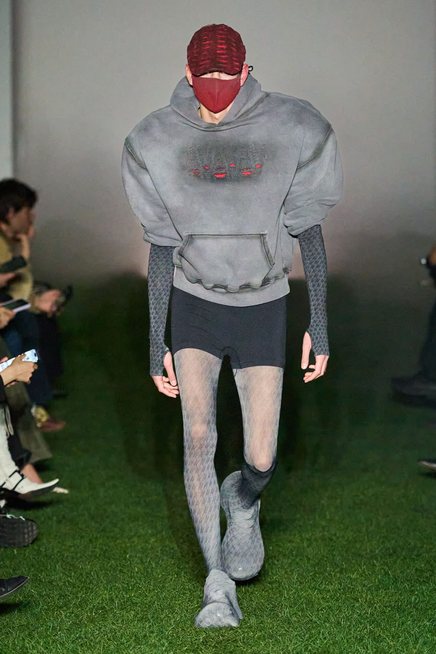 gray oversized hoodie with black shorts
