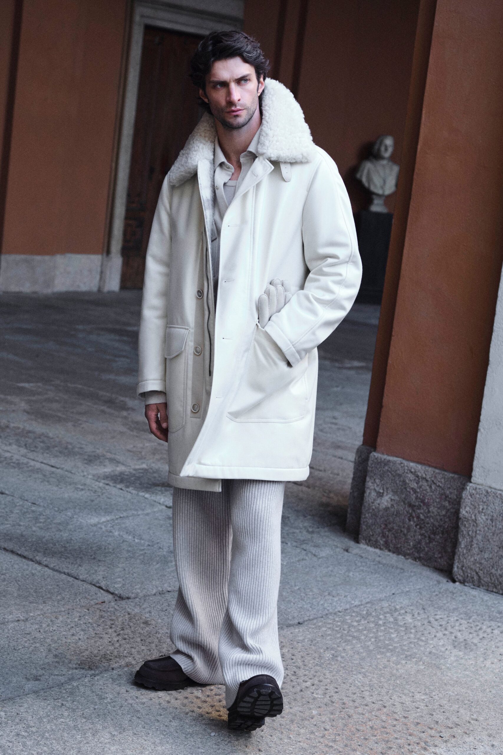 white leather long-sleeve collared relaxed buttoned coat