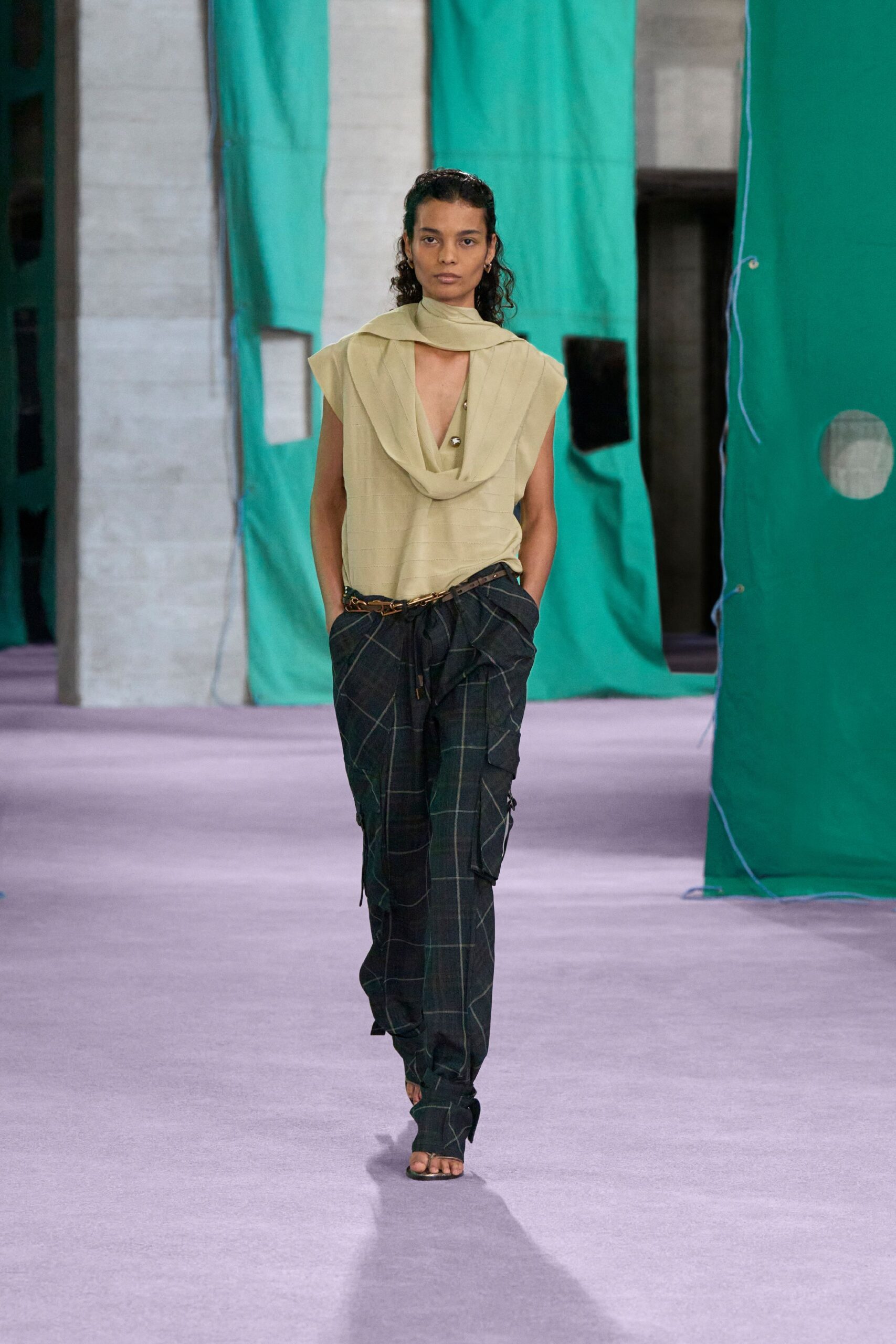 beige relaxed top with green cargo pants